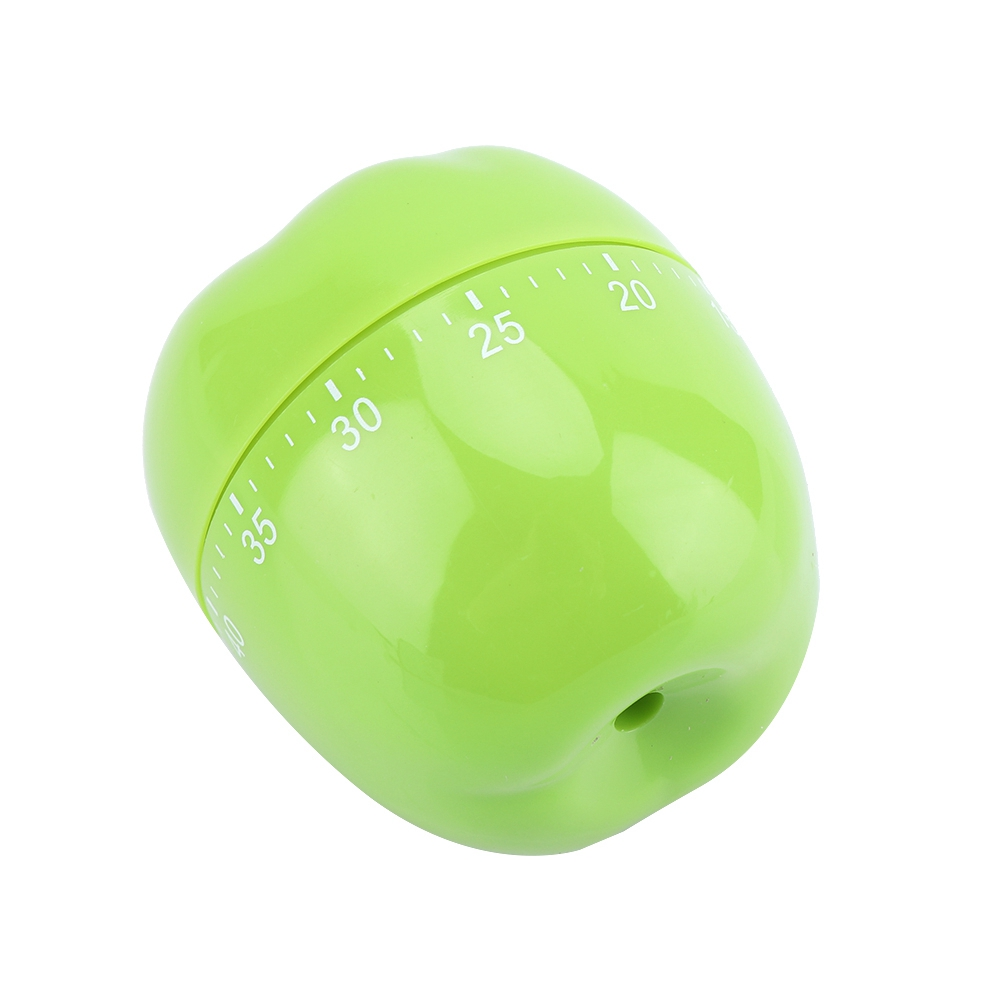 Ein grüner, apfelförmiger Küchentimer. Er hat ein Zifferblatt mit Zahlen zum Einstellen der Zeit. Der Timer befindet sich auf weißem Hintergrund.