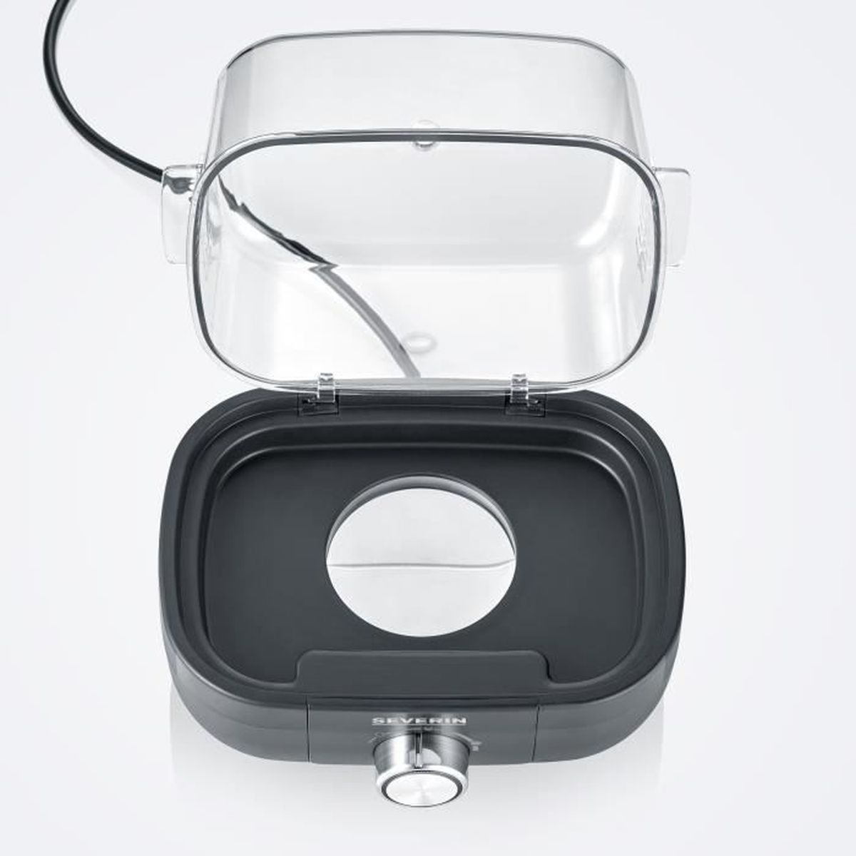 Otwarta, przezroczysta pokrywa elektrycznej podgrzewacza do żywności z ciemnoszarą podstawą, srebrnym pokrętłem i okrągłym otworem pośrodku.