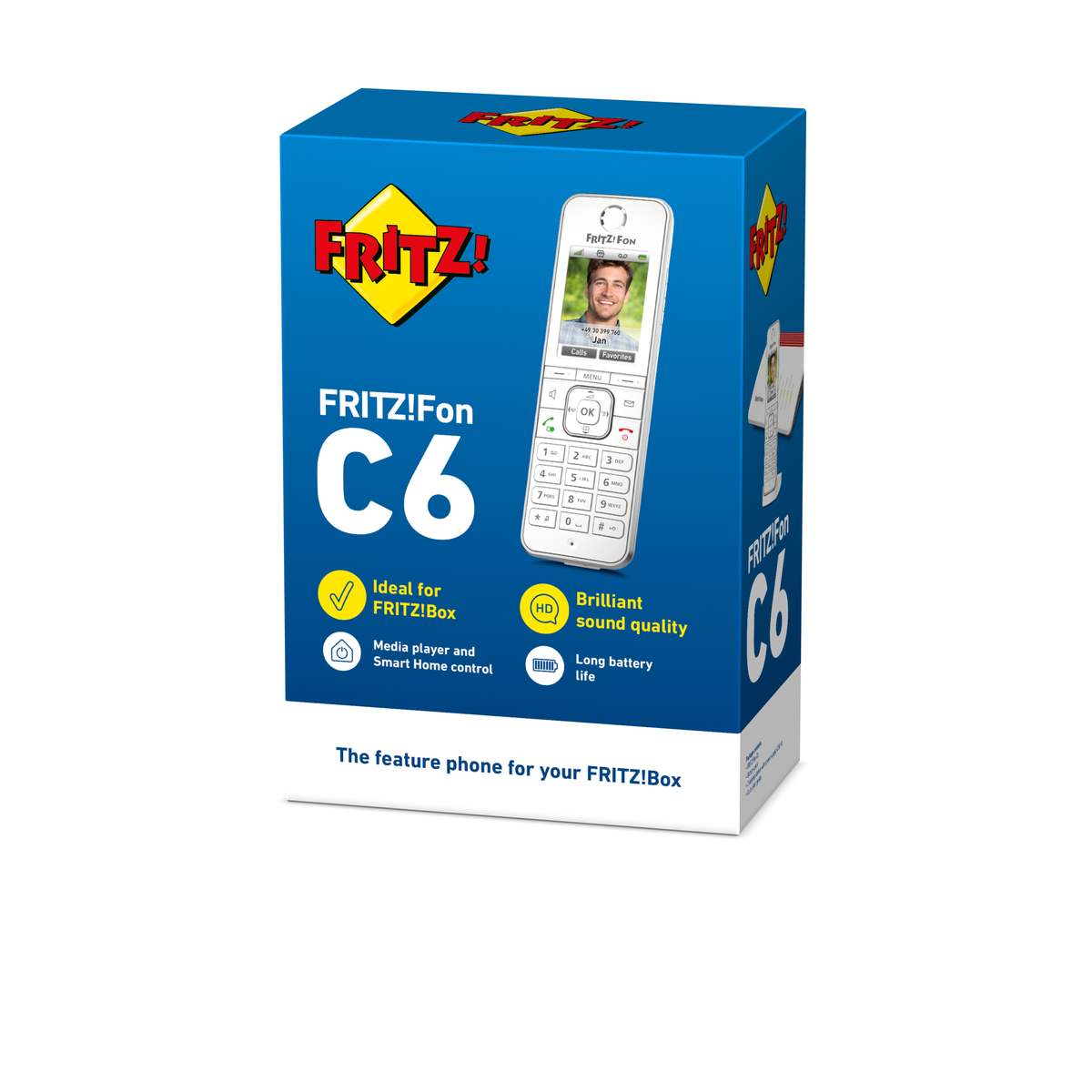 Une boîte bleue avec une image de téléphone, le téléphone est blanc, un homme souriant est sur l'écran. Le texte "FRITZ!Fon C6" est également visible.