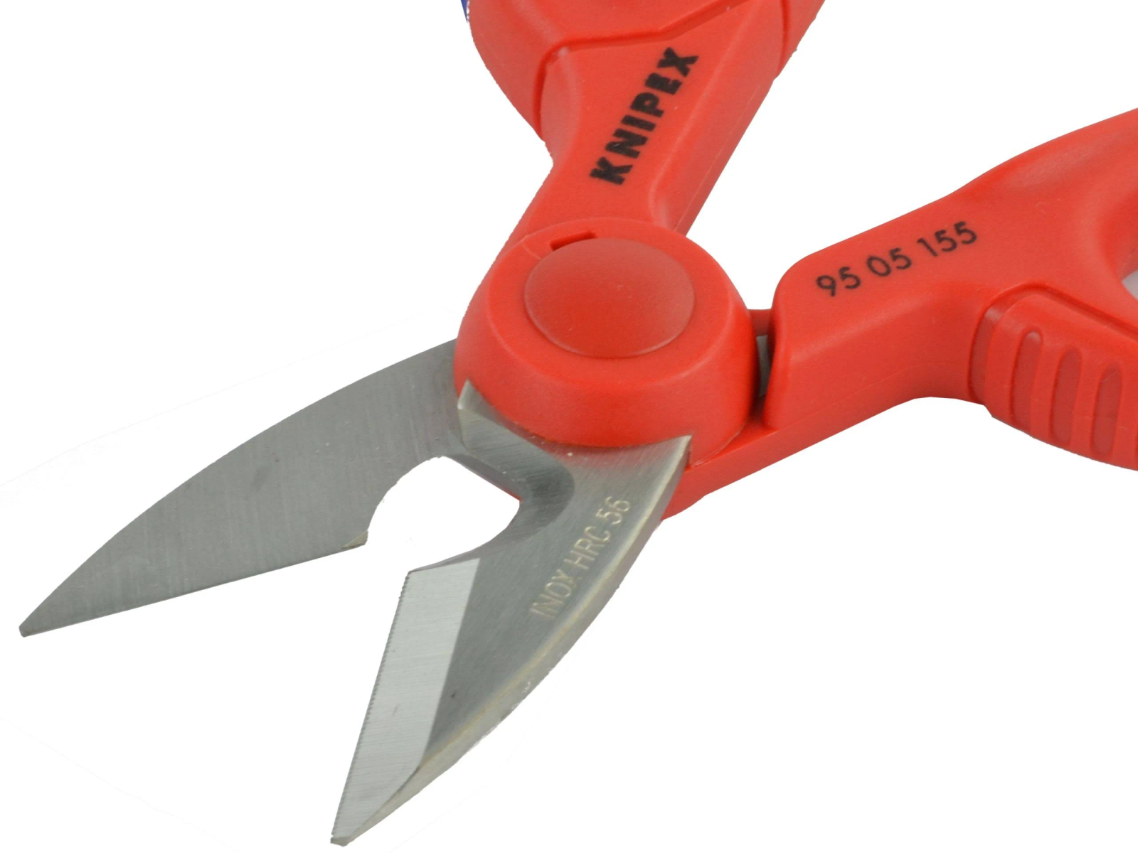 Red and silver scissors, KNIPEX brand, INOX HRC 56 marking. Blades are open. The background is white.