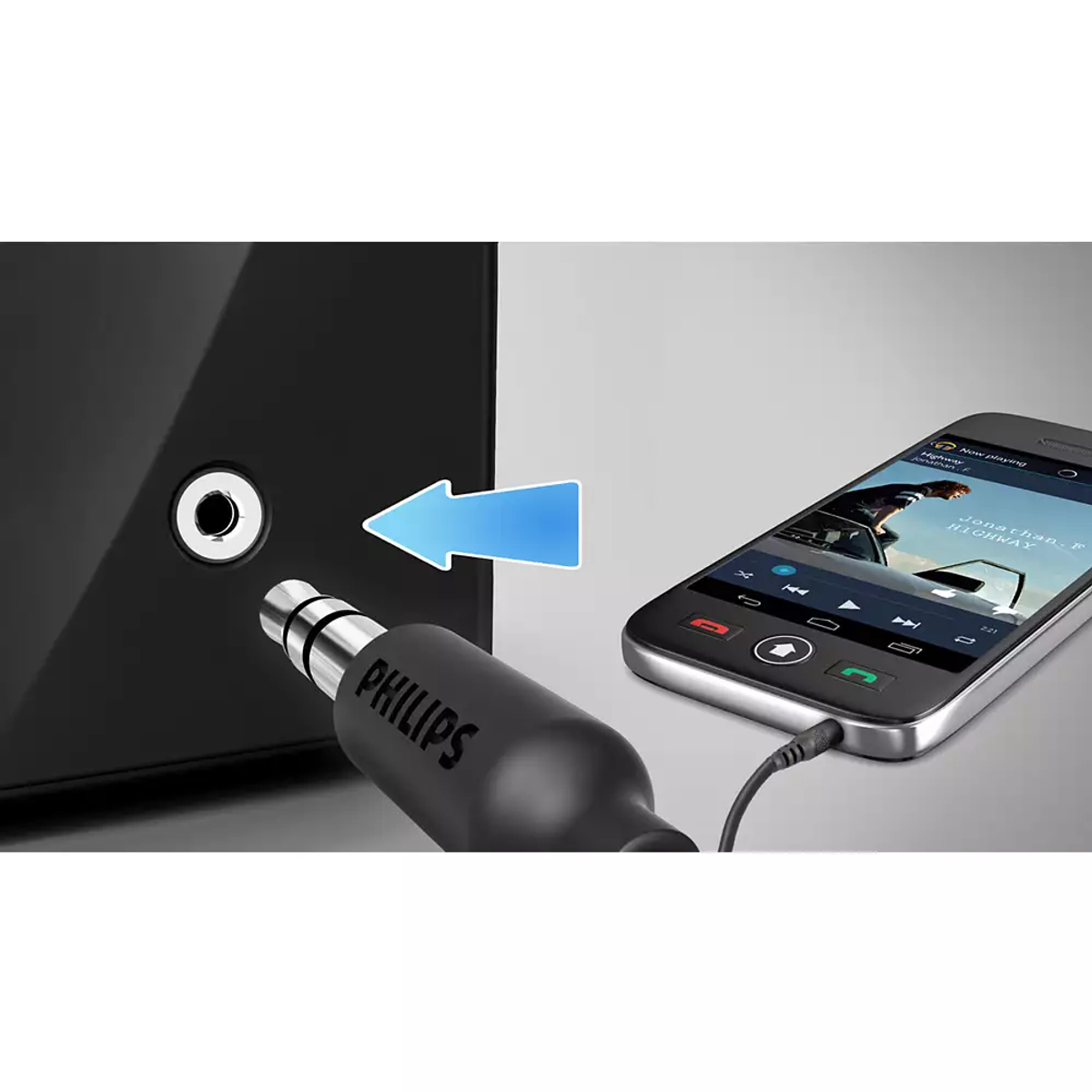 L'immagine mostra un altoparlante nero collegato a uno smartphone tramite un cavo audio da 3,5 mm. Il logo Philips è sul cavo.