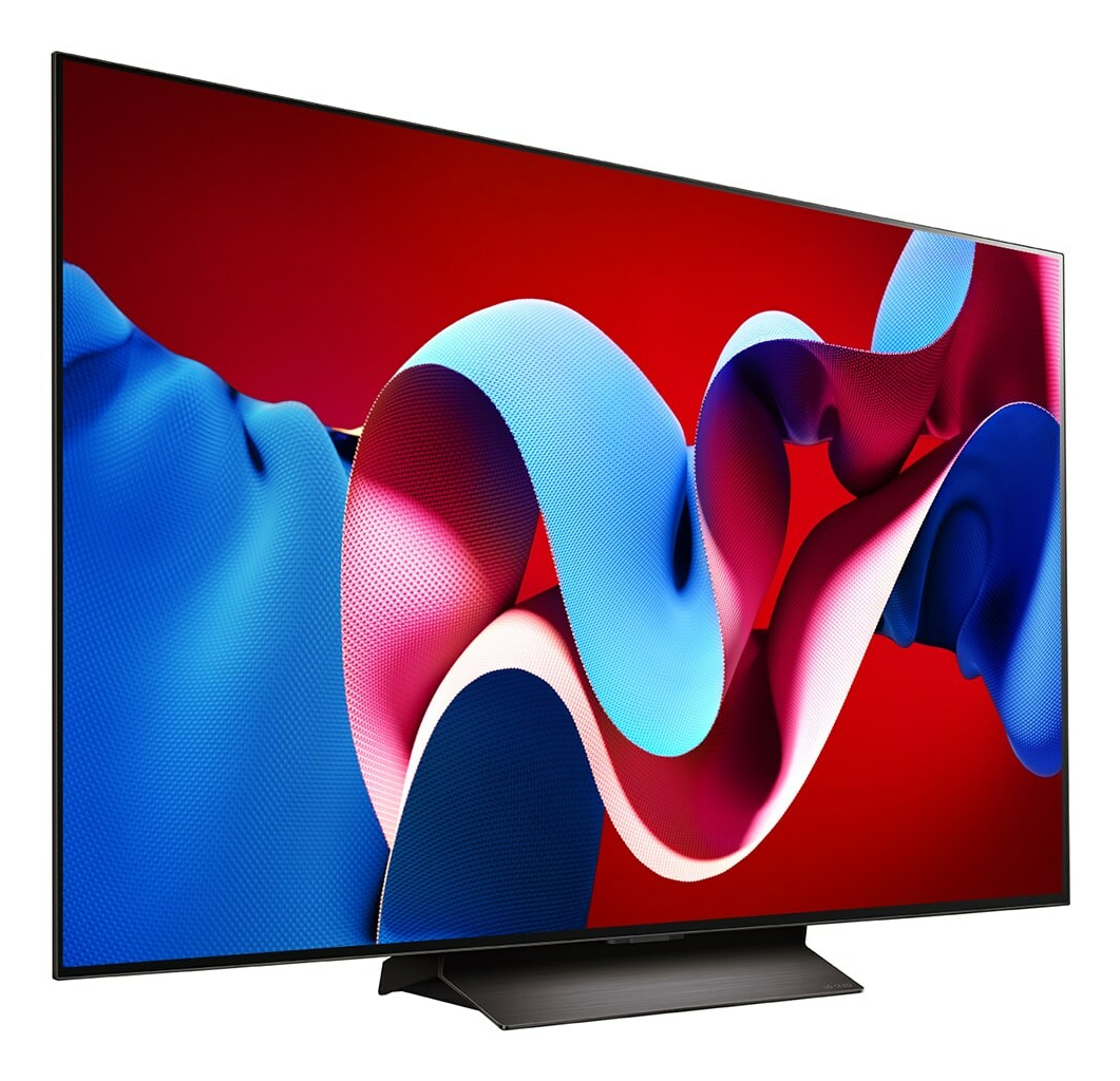 Un televisor grande con marco negro muestra un diseño abstracto vibrante de formas azules, rosas y blancas arremolinadas sobre un fondo rojo.