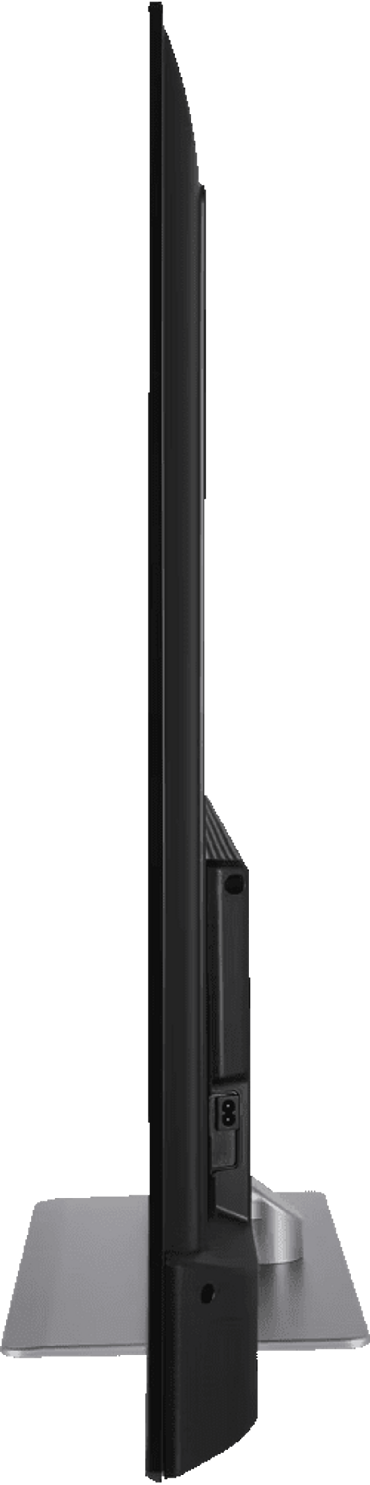 Vista lateral de un televisor de pantalla plana negro con soporte plateado. La pantalla es muy delgada.