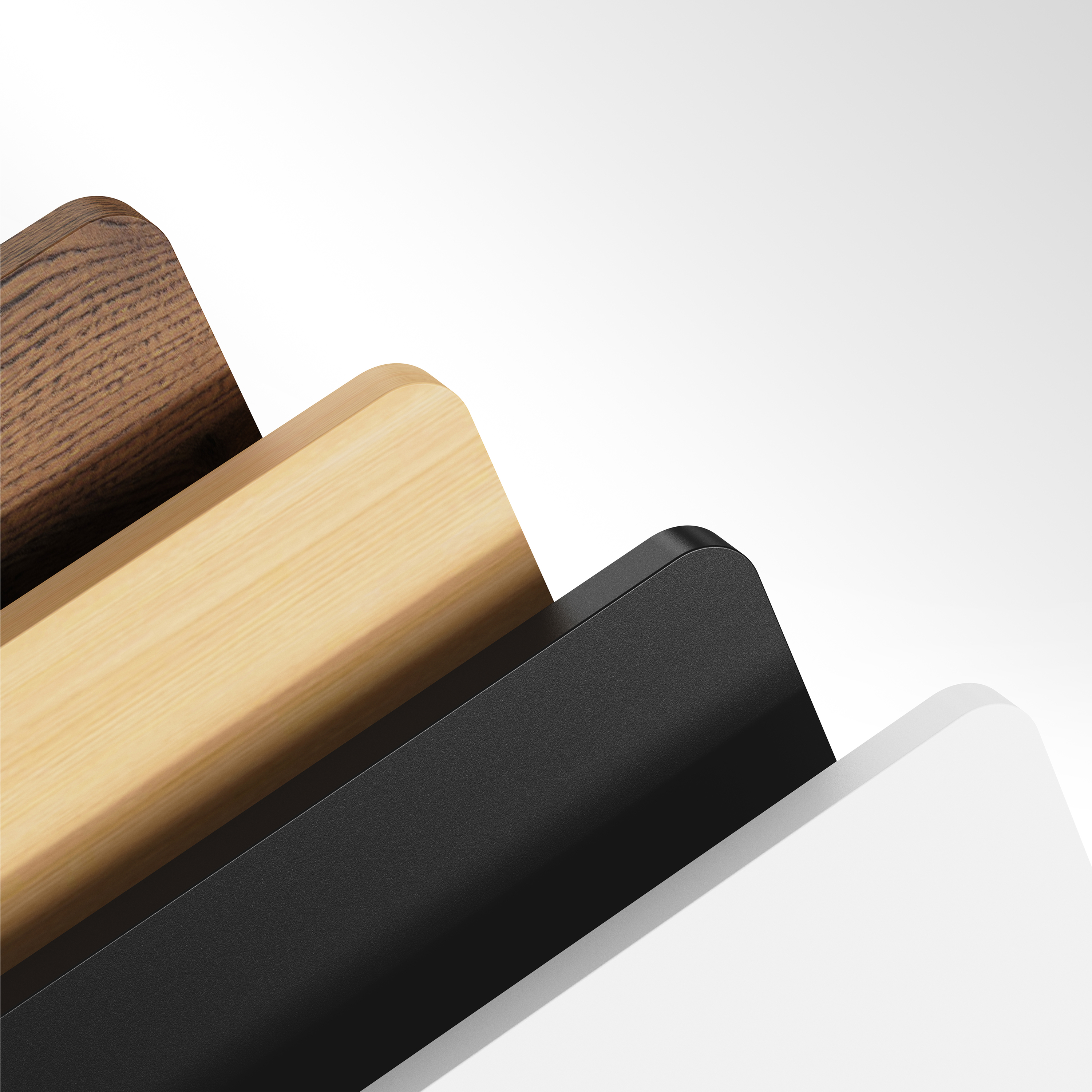 Afbeelding toont lagen hout in diverse kleuren, waaronder bruin en zwart, met een witte achtergrond.