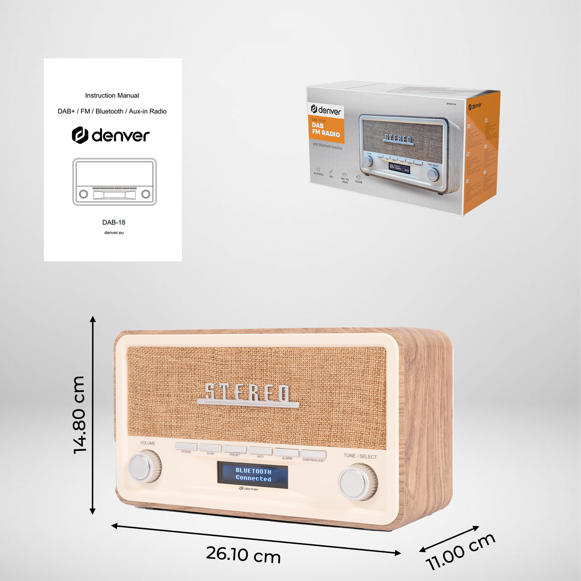 A DAB radio with a wooden frame, fabric speaker cover, and digital display. Includes an instruction manual and box with the same design.