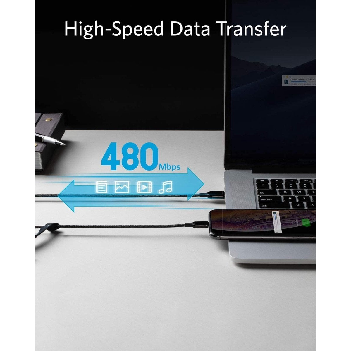 A phone is connected to a laptop with a cable. The image shows data transfer and charging. The speed is 480 Mbps.