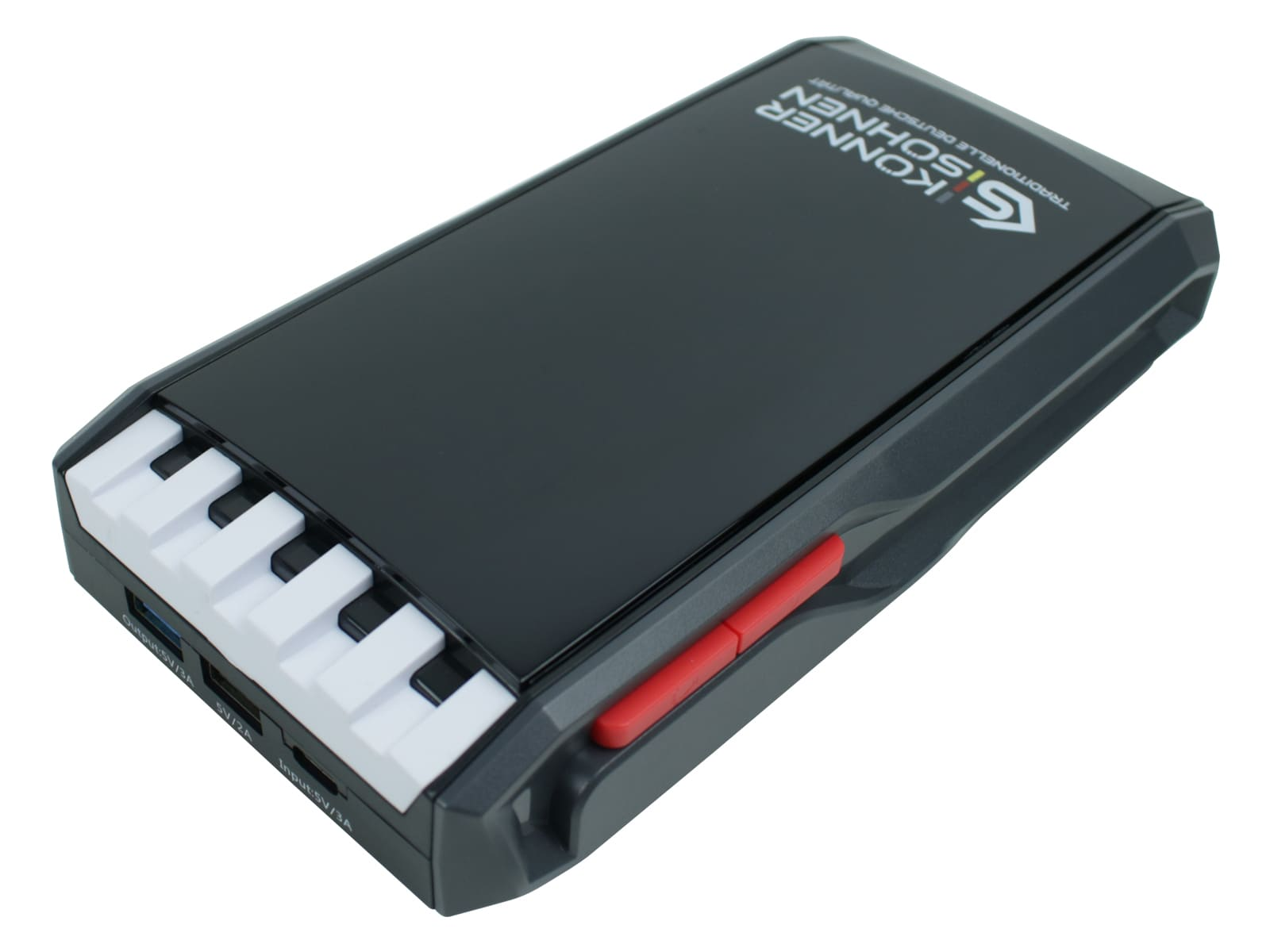 A black power bank with white piano keys on one end. It has a red button and the brand name Konner & Sohnen.