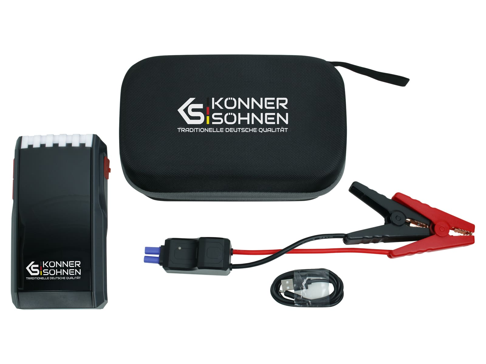 A black and red car jump starter kit. Includes a black case, clamps, a charging cable, and the jump starter itself.