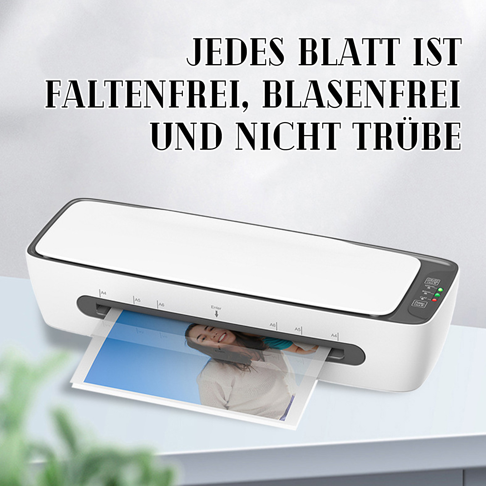 Ein weißes Laminiergerät mit einem Foto darin. Der Text oben lautet: Jedes Blatt ist faltenfrei, blasenfrei und nicht trübe.
