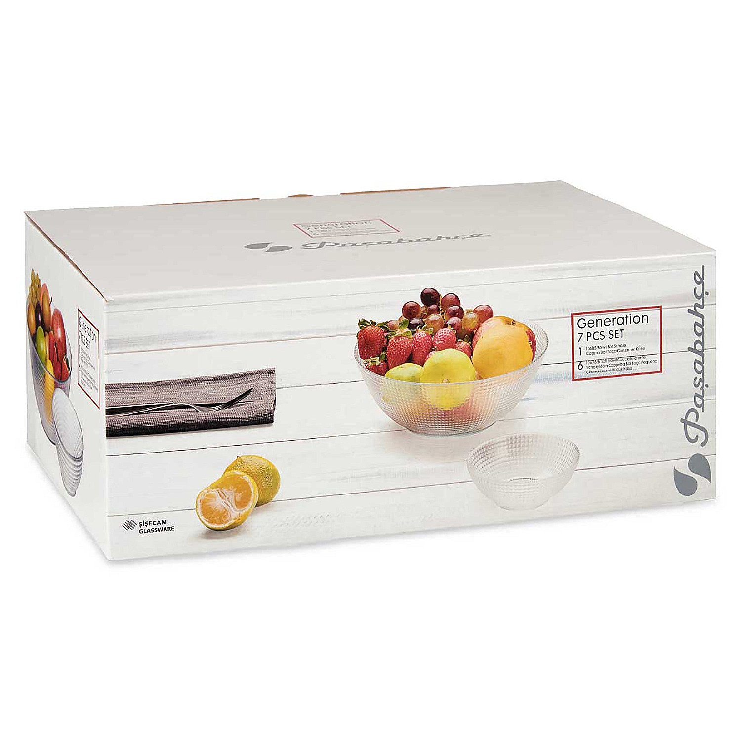 Una caja blanca con cristalería y frutas en un cuenco. La caja muestra un primer plano del cuenco con frutas y un cuenco pequeño.