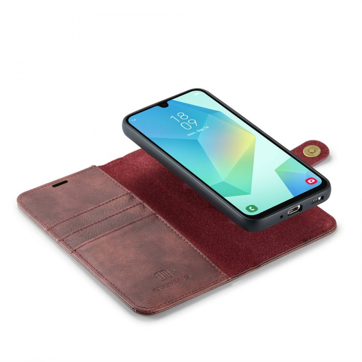 Ein Smartphone mit farbenfrohem Bildschirm liegt auf einem braunen Lederetui. Das Etui ist offen und zeigt Kartenfächer.