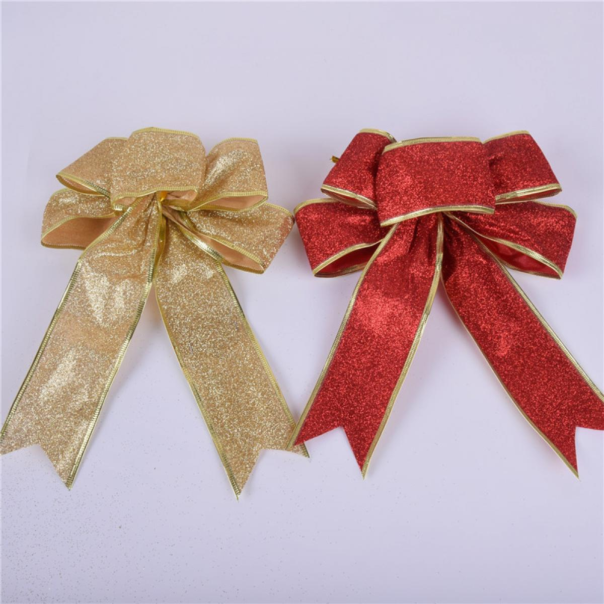 Zwei glitzernde Schleifen. Eine ist goldfarben, die andere rot. Beide haben goldene Verzierungen auf weißem Hintergrund.