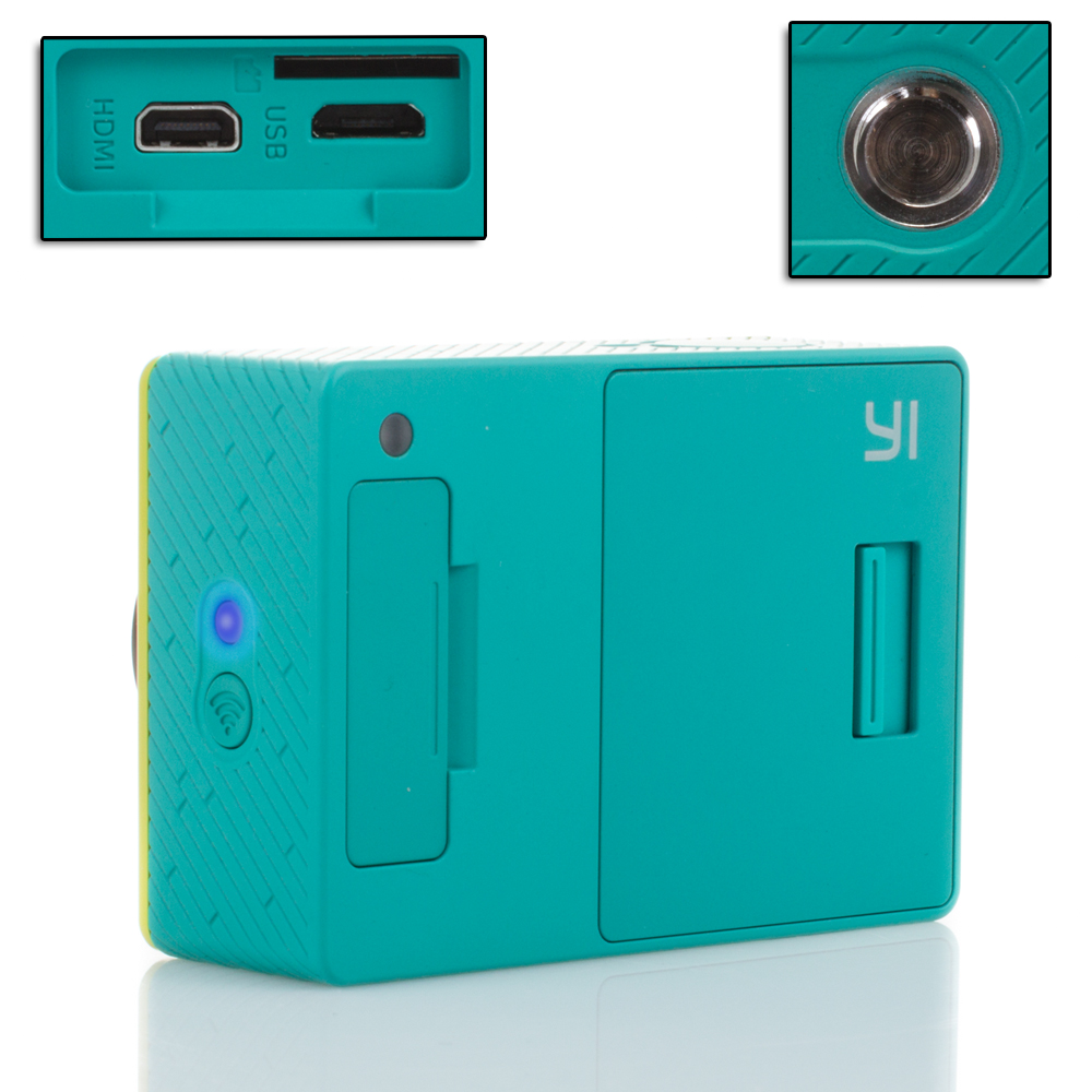 Cámara deportiva turquesa. Acentos amarillos. Puertos: HDMI, USB. Incluye un botón y luz indicadora. Logotipo 'Yi' visible.