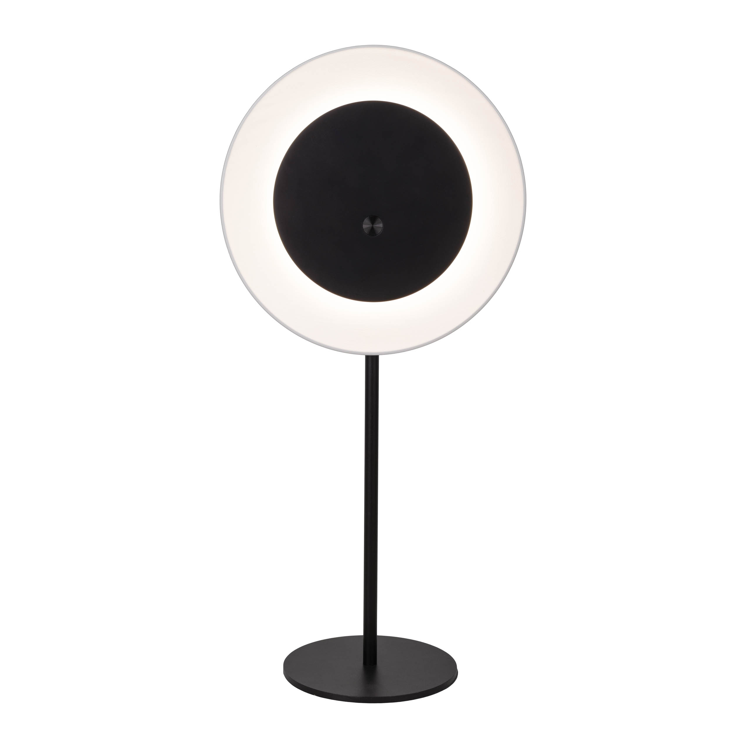 Eine moderne schwarz-weiße Lampe. Sie hat eine kreisförmige Lichtquelle mit dunkler Mitte und schwarzen Ständer.