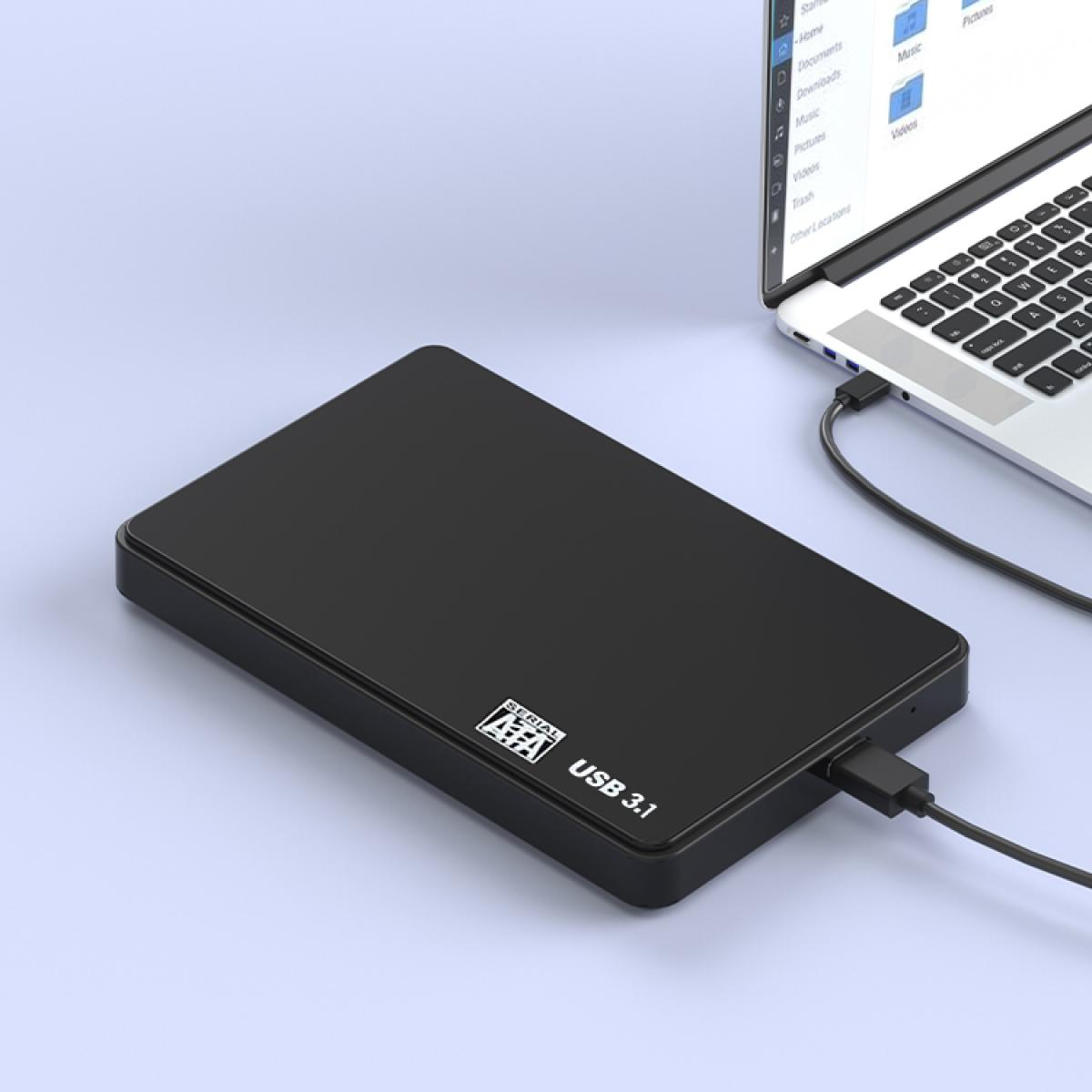Eine schwarze externe Festplatte, die über ein USB-Kabel mit einem Laptop verbunden ist. Der Laptop ist geöffnet und zeigt eine Dateiexplorer-Oberfläche.
