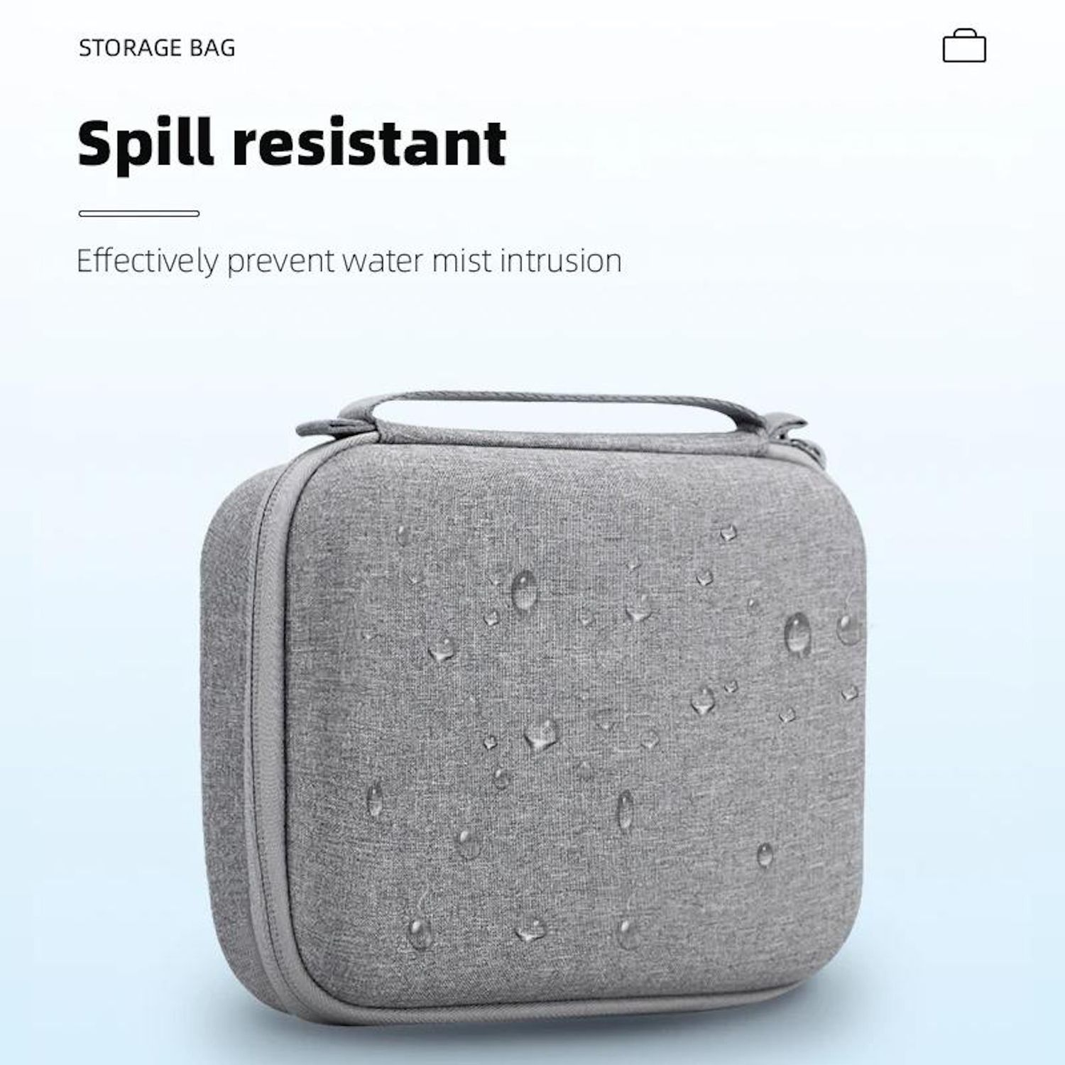 Borsa portaoggetti grigia a prova di versamento con goccioline d'acqua. Testo: A prova di versamento. Previene efficacemente l'intrusione di nebbia d'acqua.