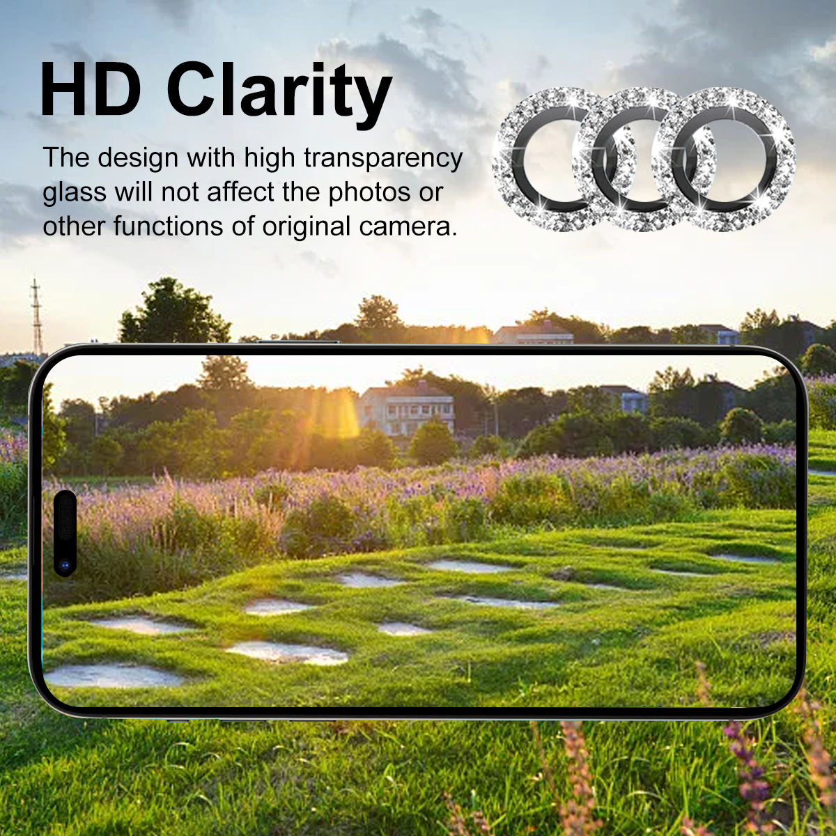 Ein Telefon zeigt ein sonniges Feld mit Blumen, einem Haus und einem Himmel. Drei Diamantringe sind in der oberen rechten Ecke.