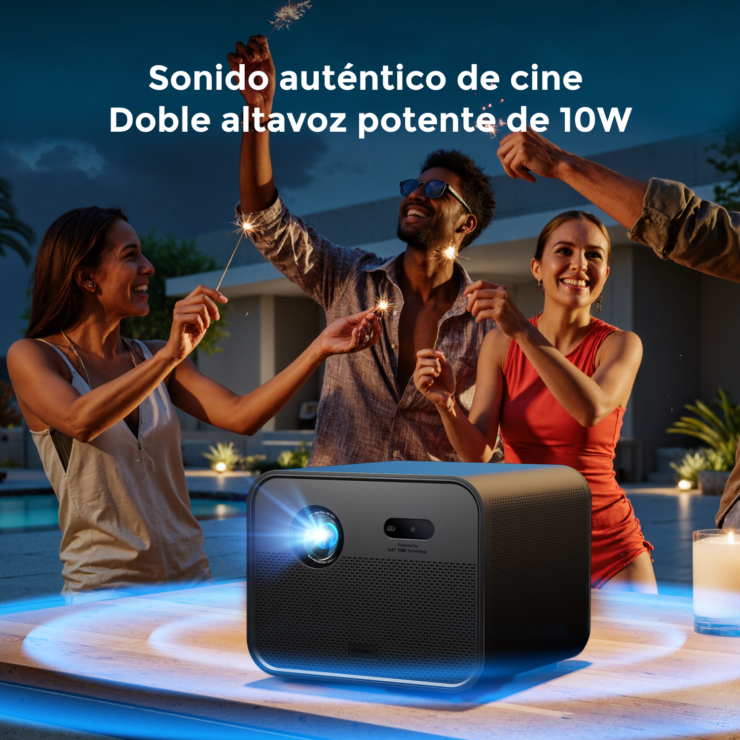 Gente con bengalas alrededor de un proyector sobre una mesa. El fondo muestra una piscina y el cielo.