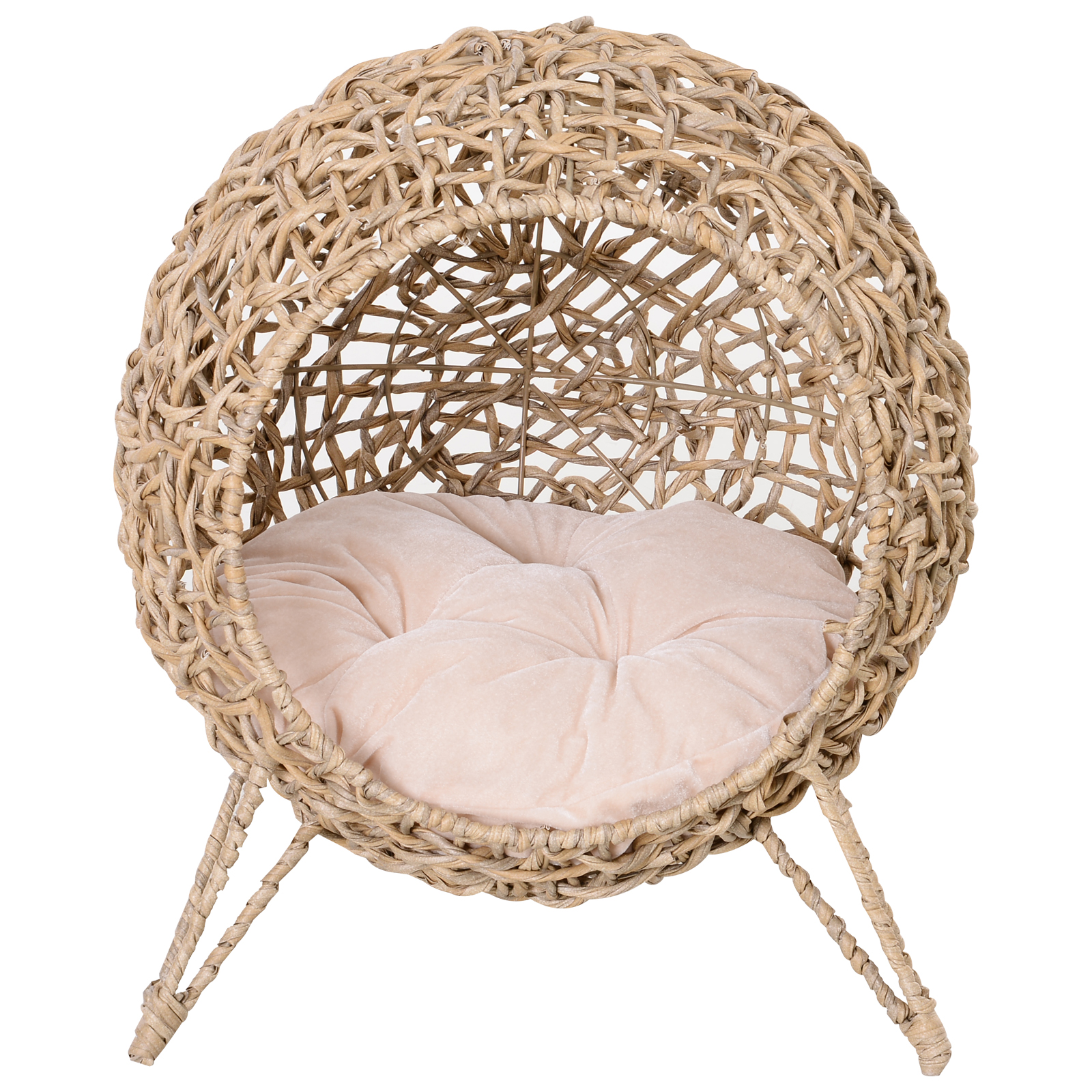 Una cama tejida de mimbre para mascotas, de forma redondeada con un cojín rosa claro en el interior. La cama tiene tres patas.