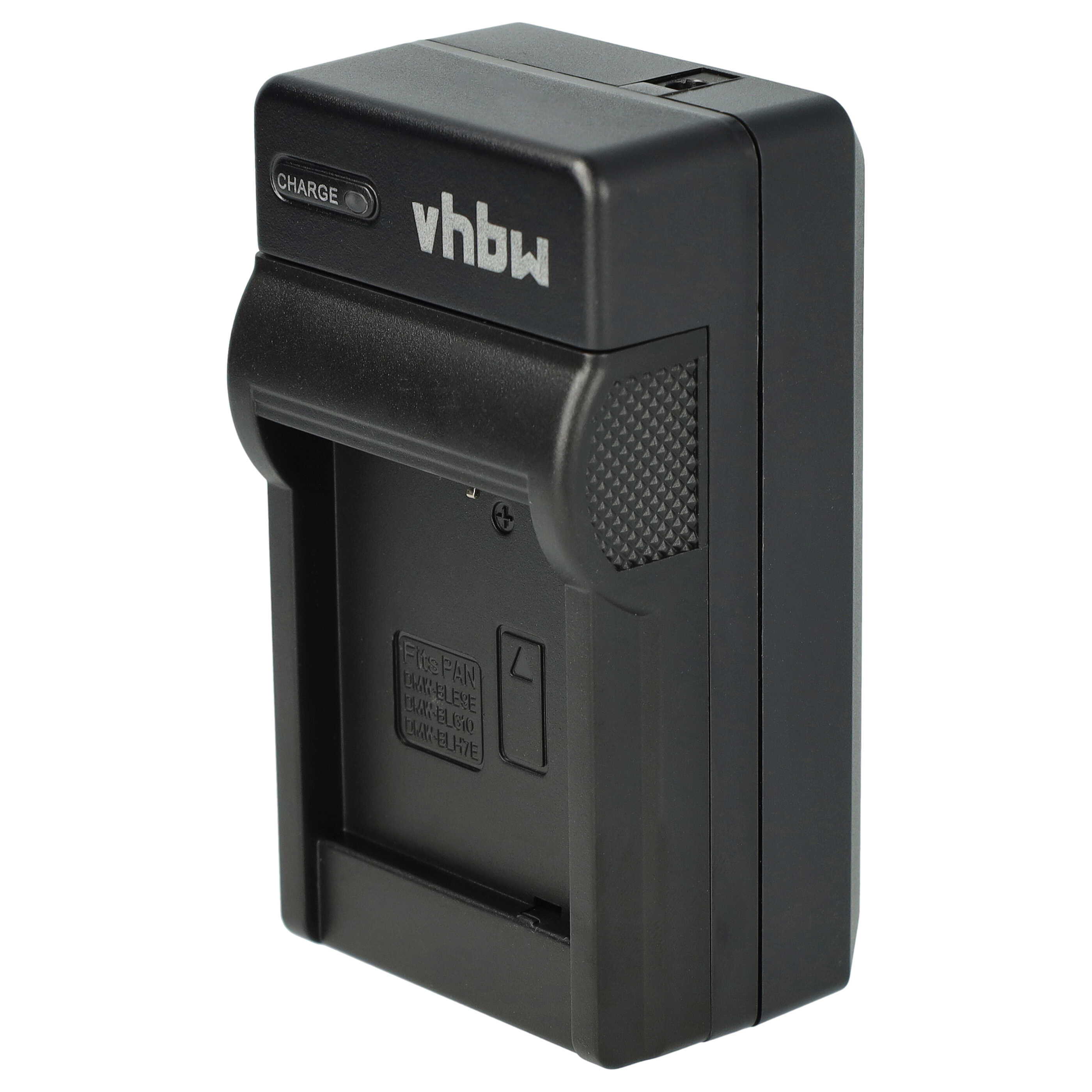 Schwarzes Kamerabatterieladegerät. Mit Markennamen 'vhbw' und 'CHARGE'-Anzeige. Details an der Seite.