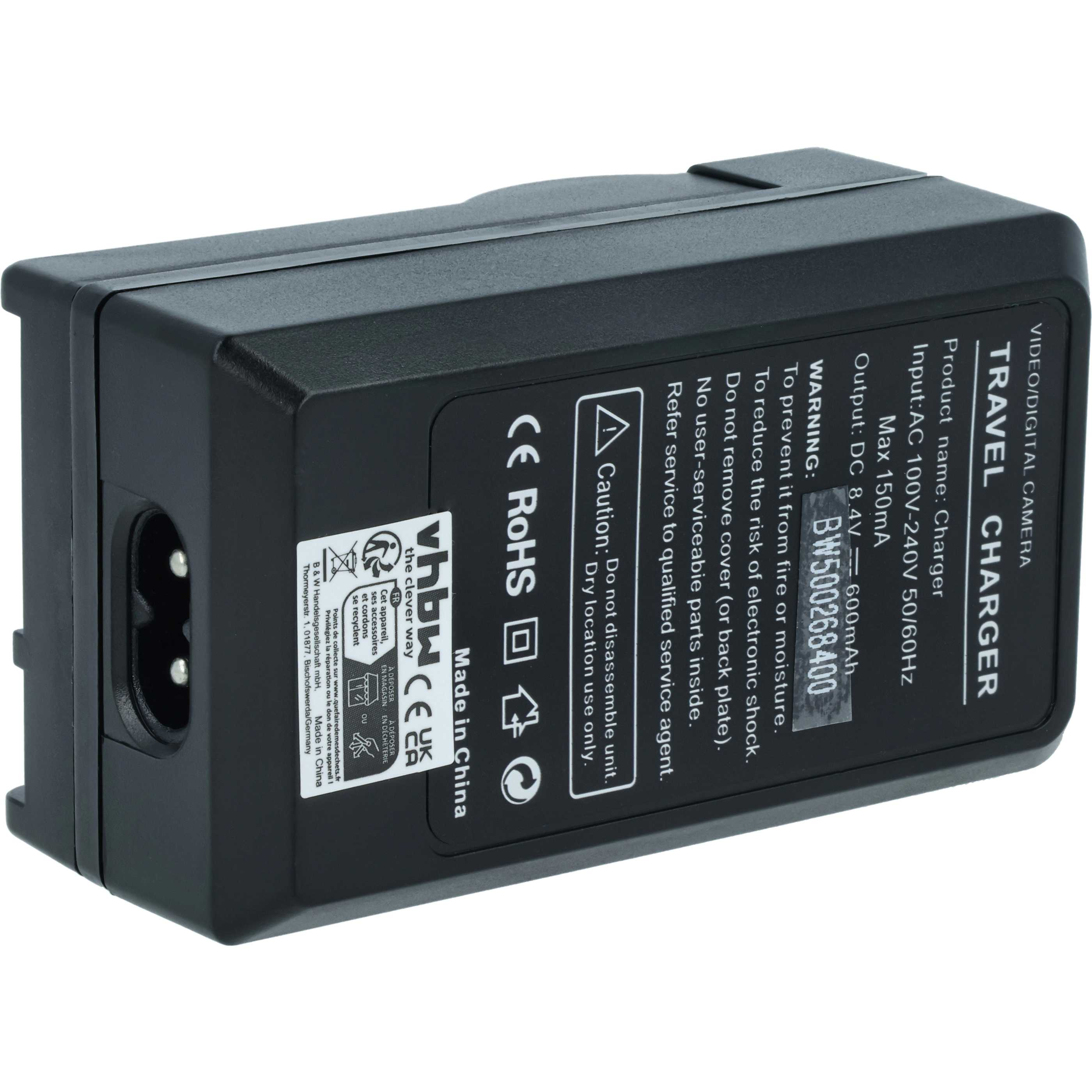 Schwarzes Reise-Ladegerät mit der Aufschrift 'VIDEO/DIGITAL CAMERA TRAVEL CHARGER'. Enthält Warnungen und technische Daten.