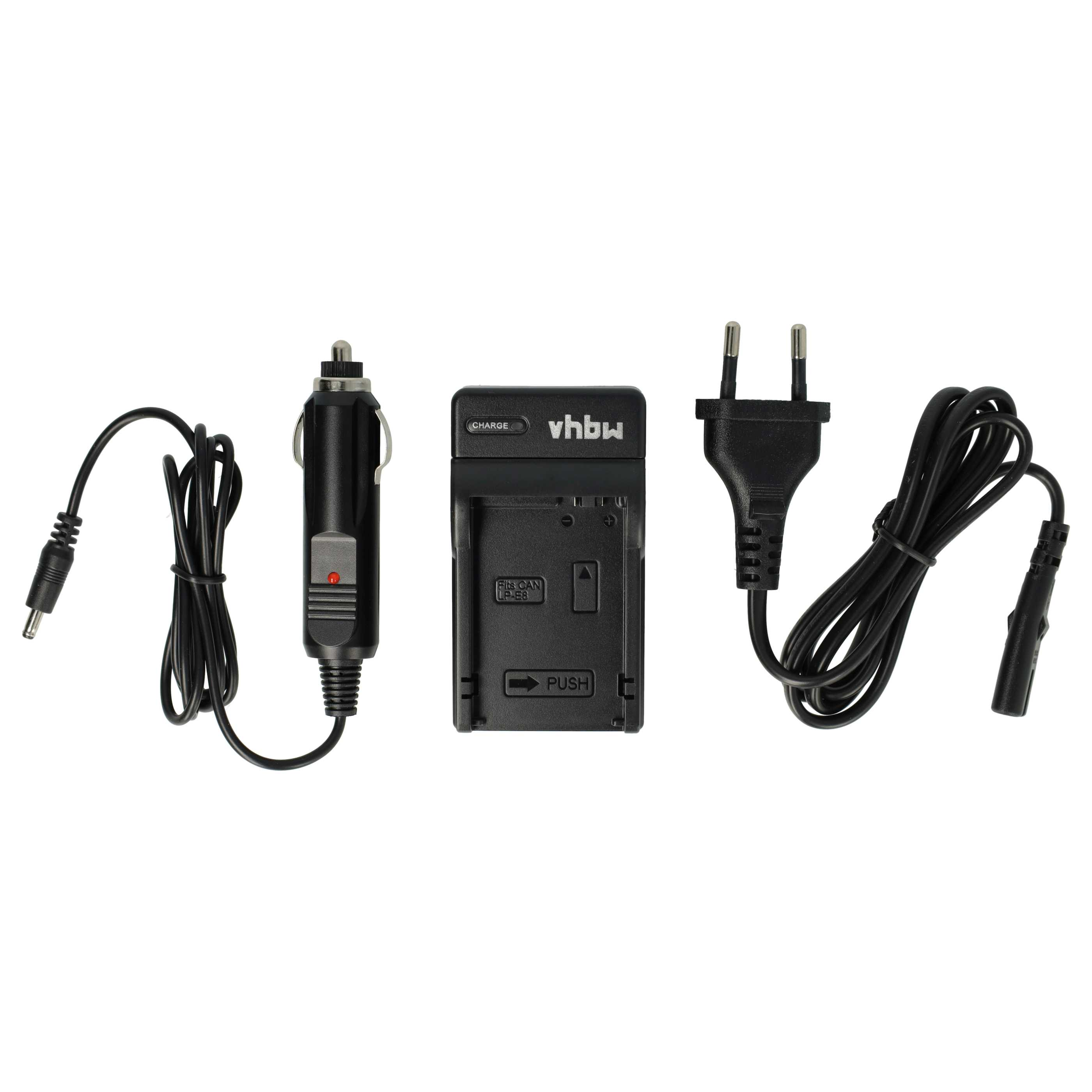 Ein schwarzes Ladegerät mit Autoadapter, Ladegerät und Netzstecker, alles auf weißem Hintergrund.