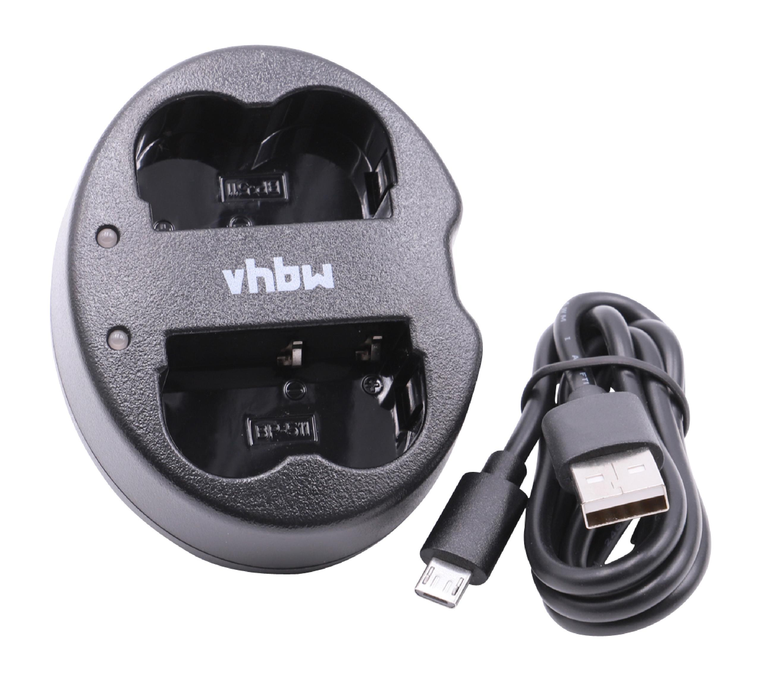 Ein schwarzes Batterieladegerät mit zwei Schlitzen und einem USB-Kabel. Auf dem Ladegerät steht 'vhbw'.