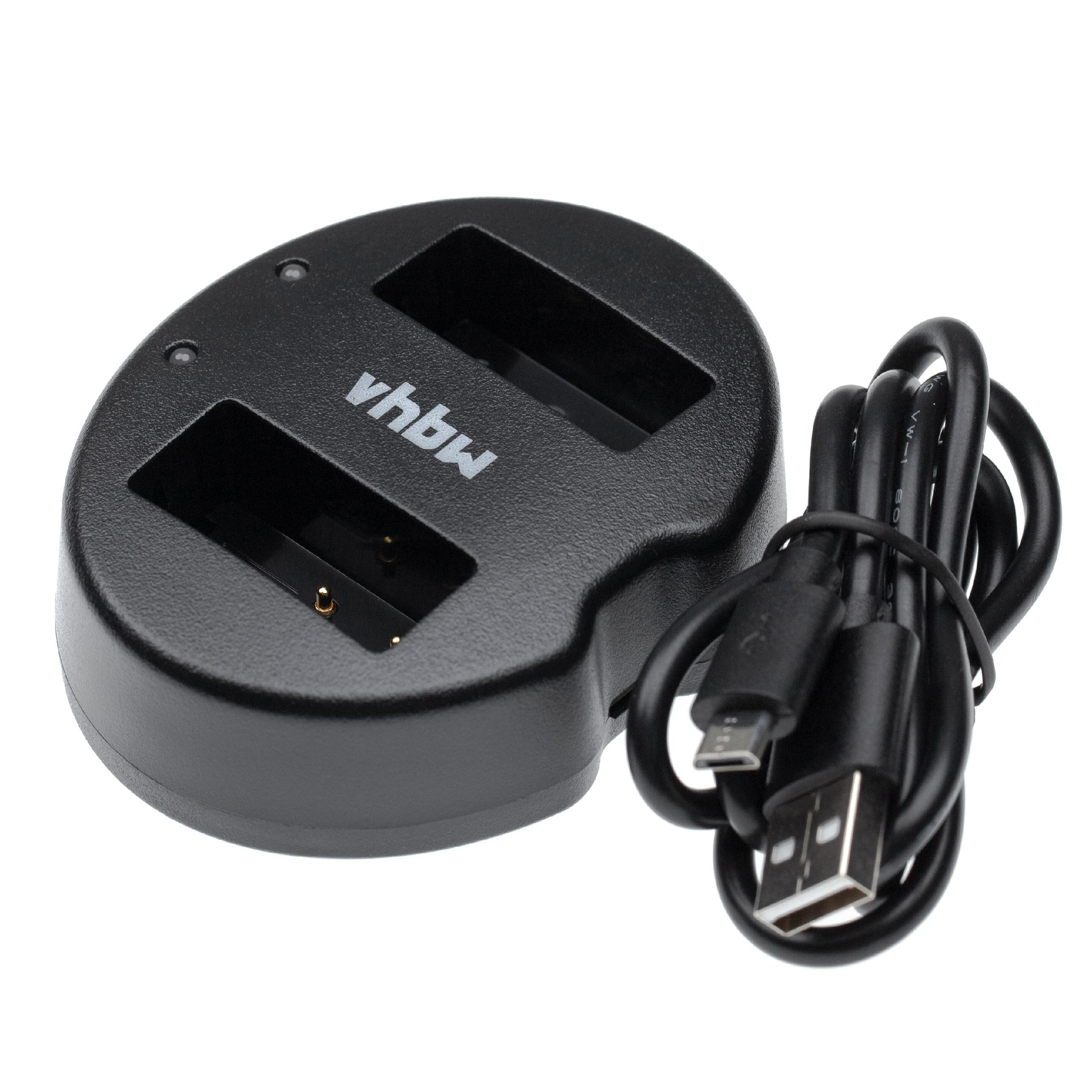 Schwarzes vhbw-Doppelladegerät mit USB-Kabel. Das Ladegerät hat zwei Steckplätze und eine Ladeanzeige. Weißer Hintergrund.