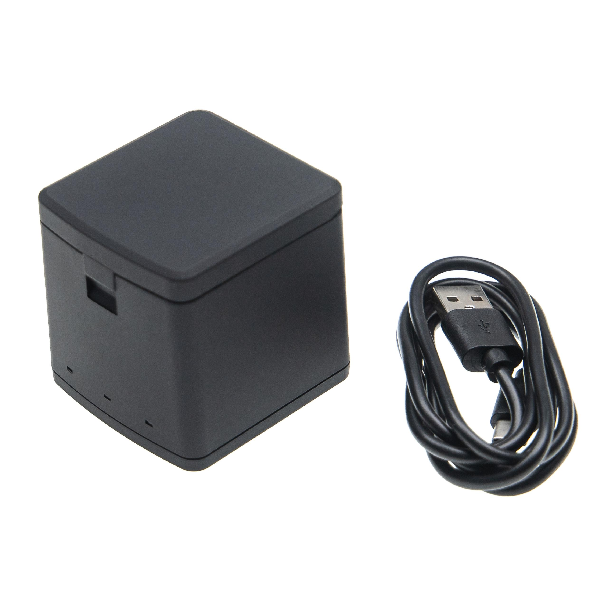 Schwarzes quaderförmiges Gerät mit USB-Kabel auf weißem Hintergrund.