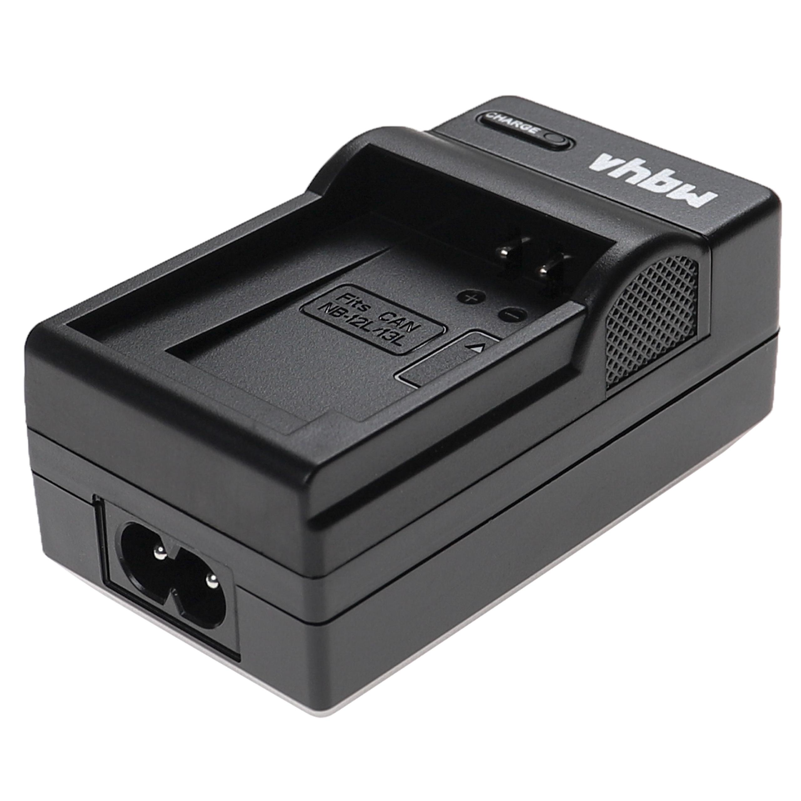 Schwarzes Batterieladegerät mit vertieftem Oberteil, Stromeingang und dem Markennamen 'vhbw'. Es hat eine 'Lade'-Anzeige.