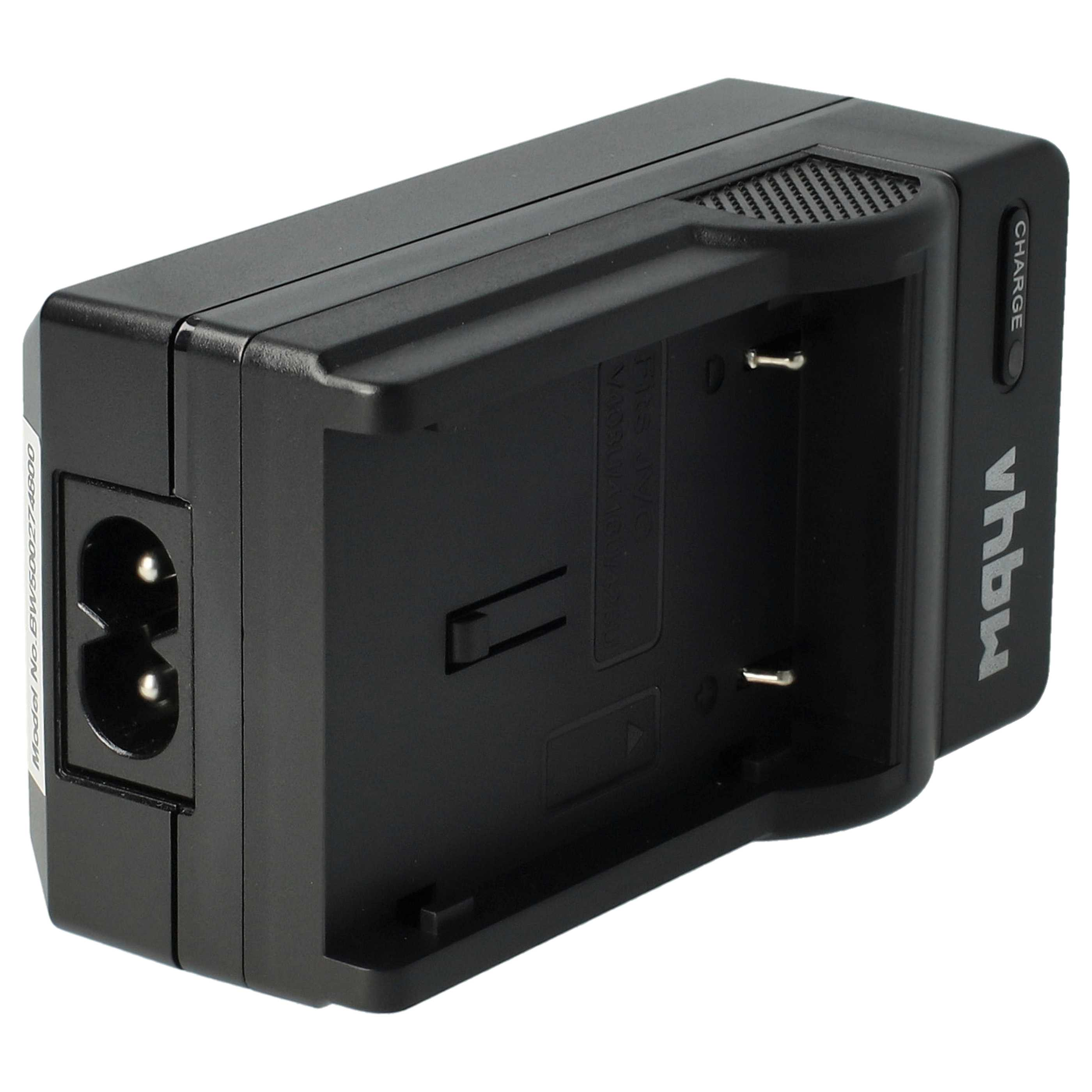 Ein schwarzes Batterieladegerät mit Stromeingang, Ladeschacht und „Charge“-Anzeige.