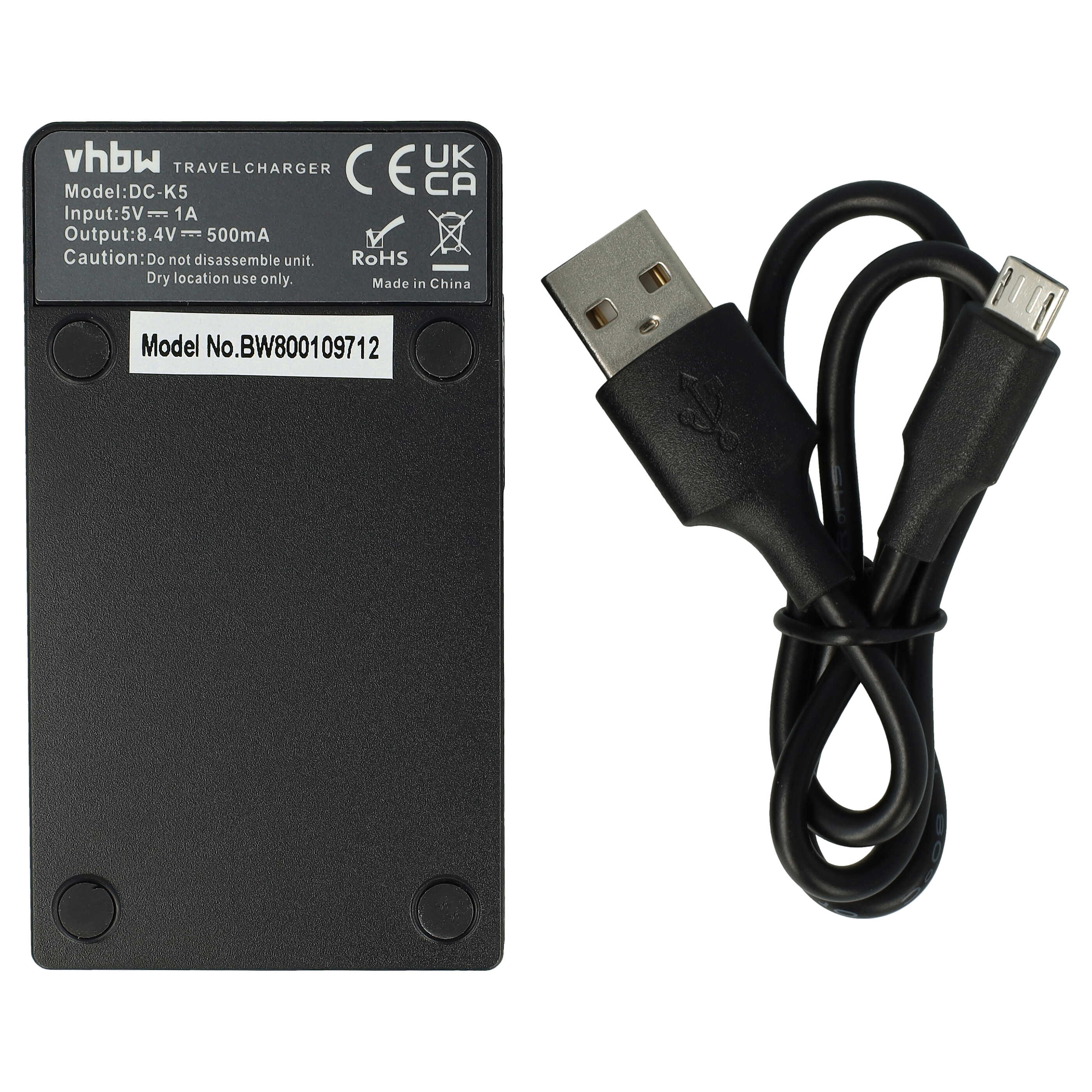 Ein schwarzes Reisegerät mit USB-Kabel. Das Ladegerät hat Text und Symbole. Das Kabel ist schwarz, aufgerollt und hat zwei Steckverbindungen.