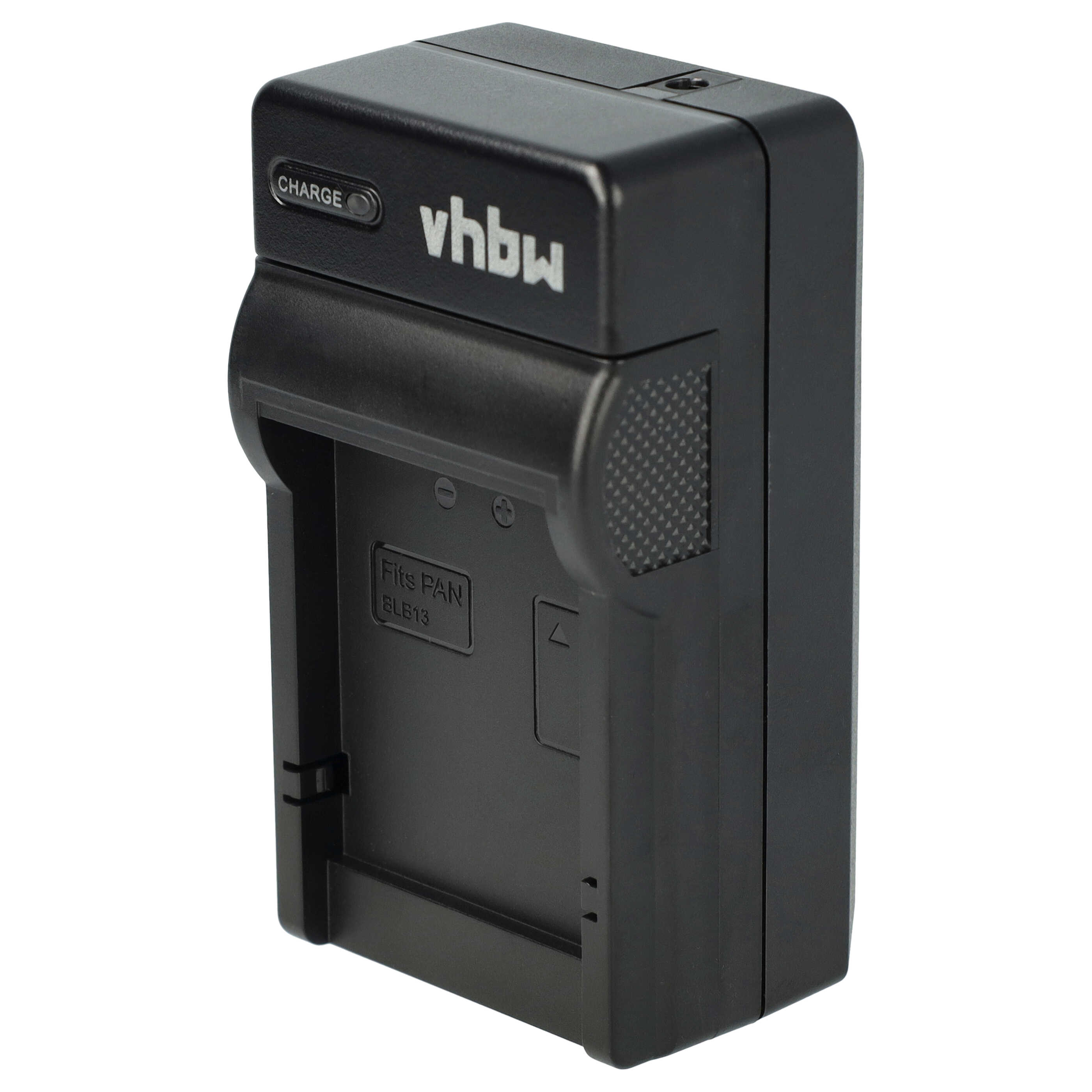 Ein schwarzes vhbw-Akkuladegerät auf weißem Hintergrund. Es hat einen Steckplatz für einen Akku und eine Ladeanzeige.