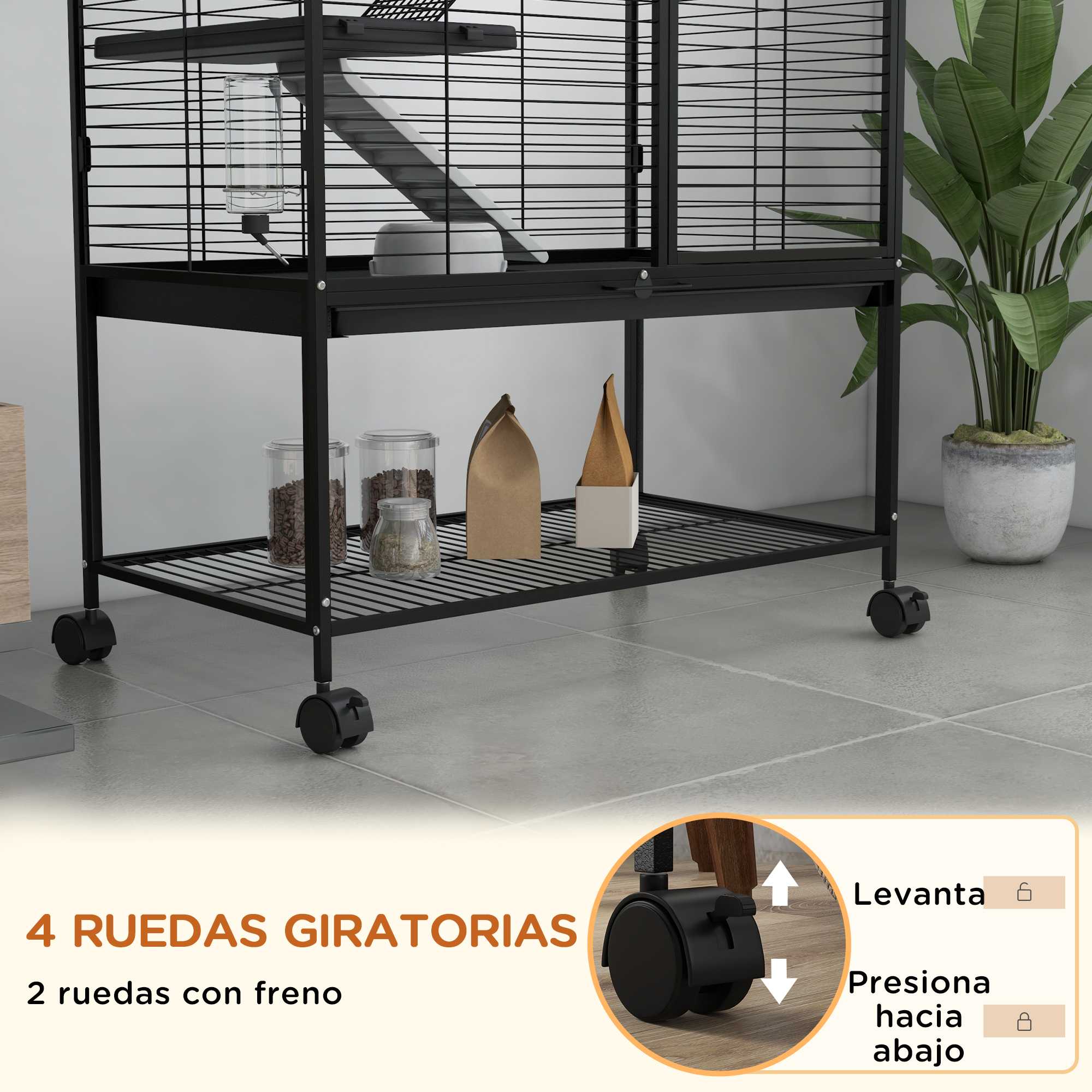 Jaula negra con accesorios sobre ruedas y una planta. La jaula tiene un bebedero y recipientes de comida.