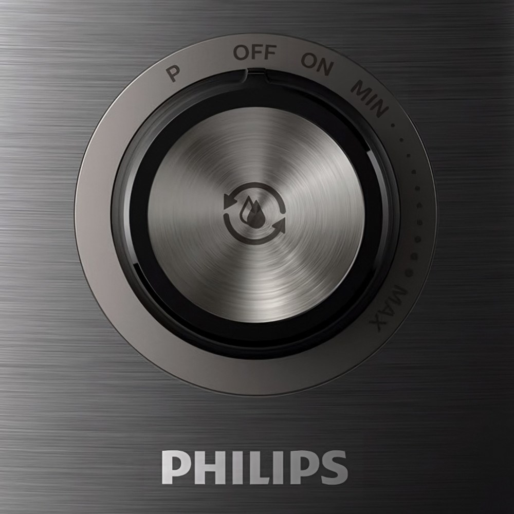 Zbliżenie srebrnego pokrętła z symbolem kropli wody, otoczone ustawieniami ON, OFF i MAX. Logo Philips na dole.