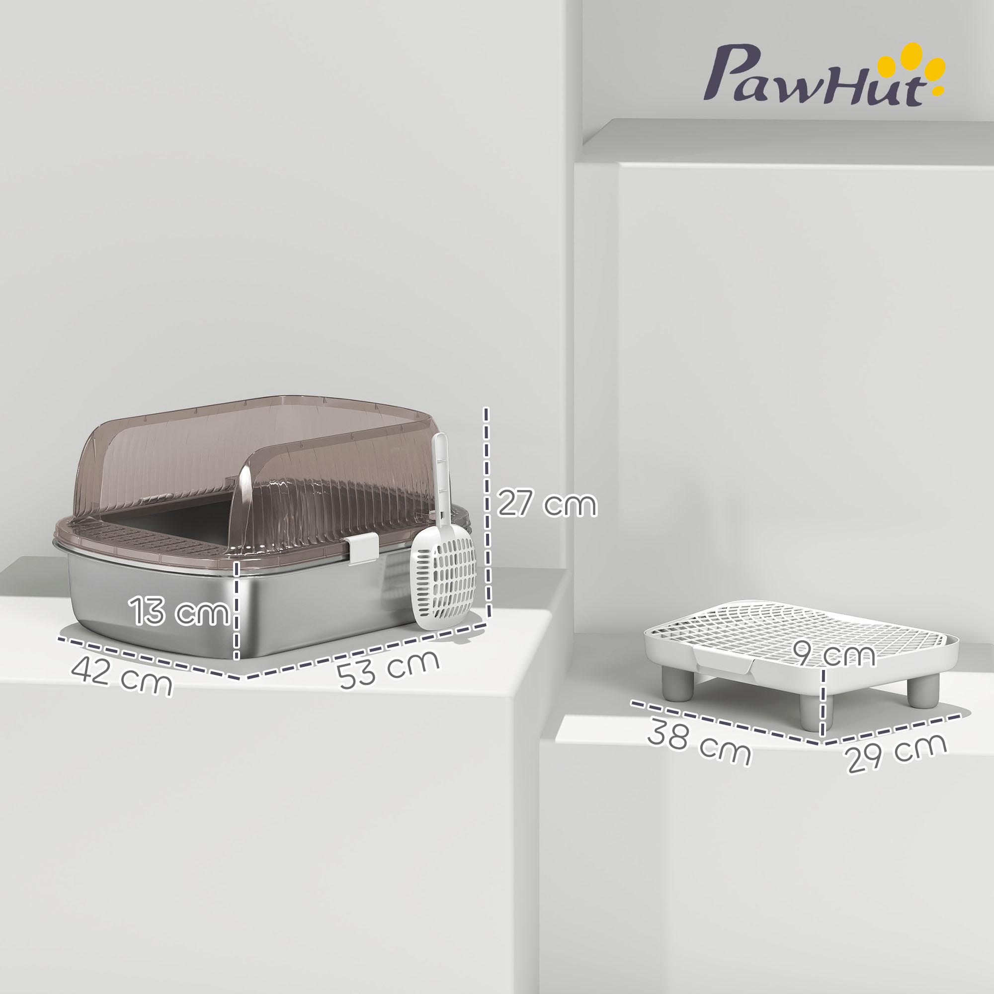 Arenero gris con tapa transparente y pala blanca. Un escalón blanco junto a él. Dimensiones etiquetadas.