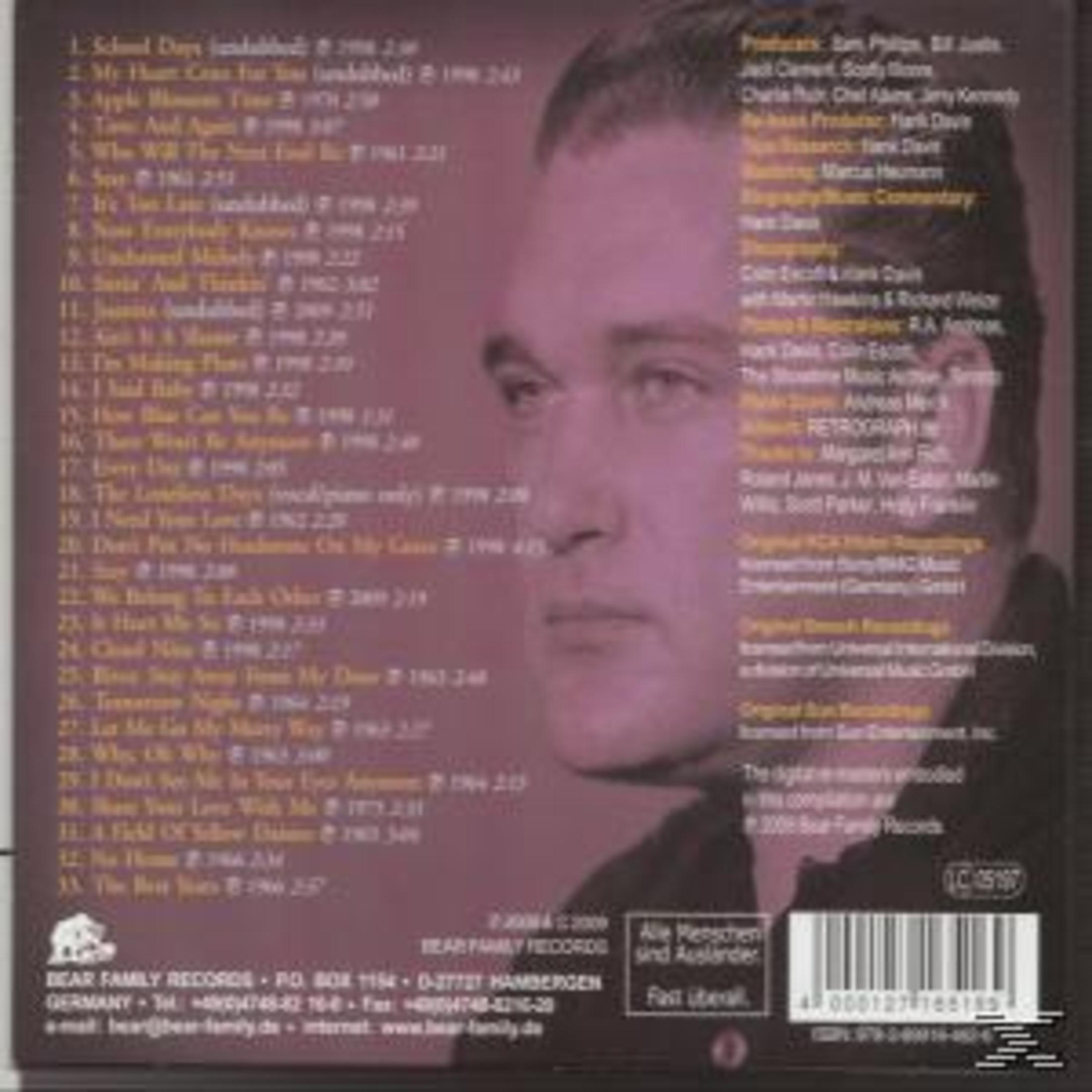 Albumcover mit dem Gesicht eines Mannes. Text enthält Songtitel und Credits. Der Hintergrund ist dunkelrosa.