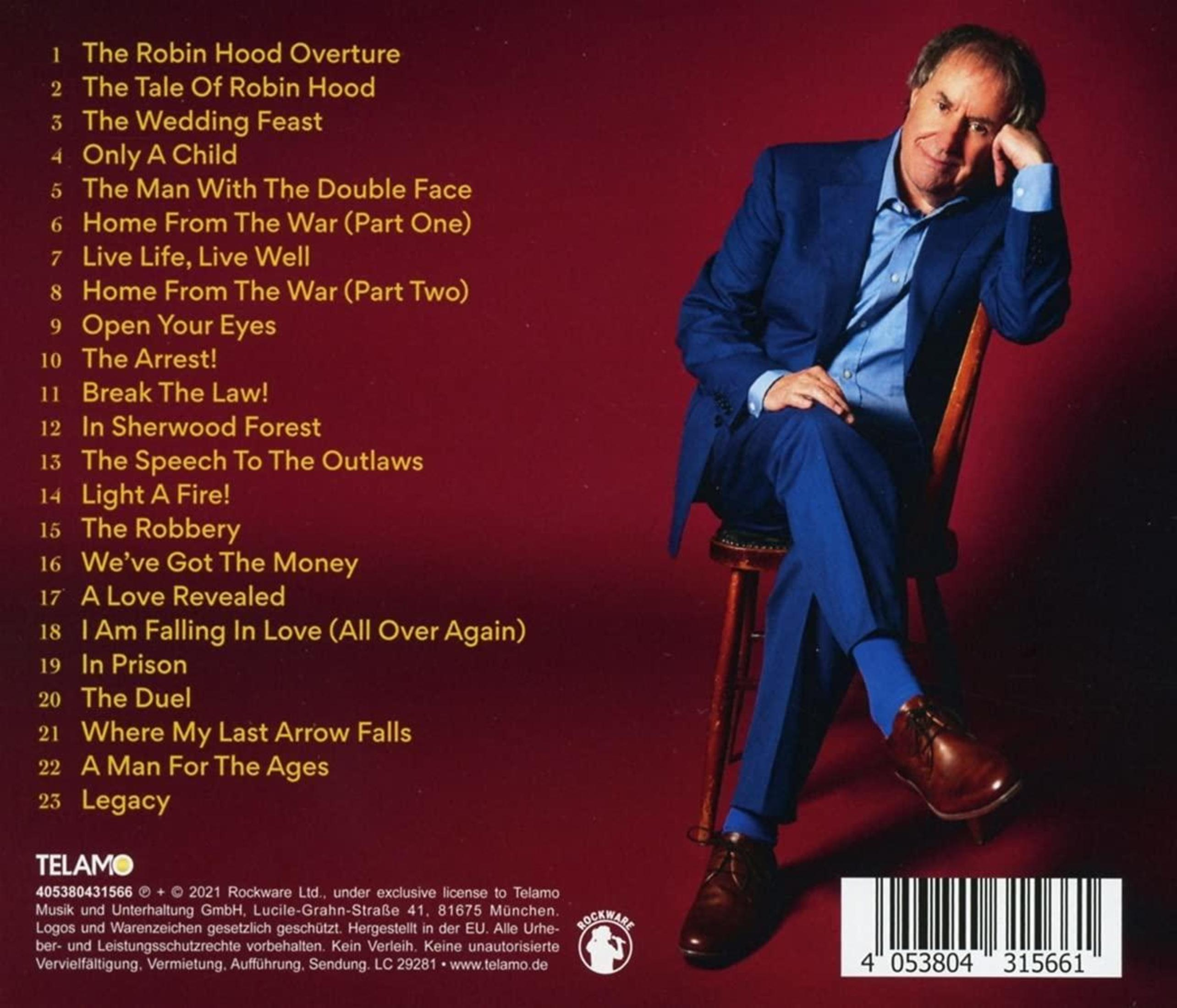 Mann in blauem Anzug sitzt auf einem Hocker vor rotem Hintergrund. Album-Trackliste wird angezeigt. Albumtitel ist Legacy.