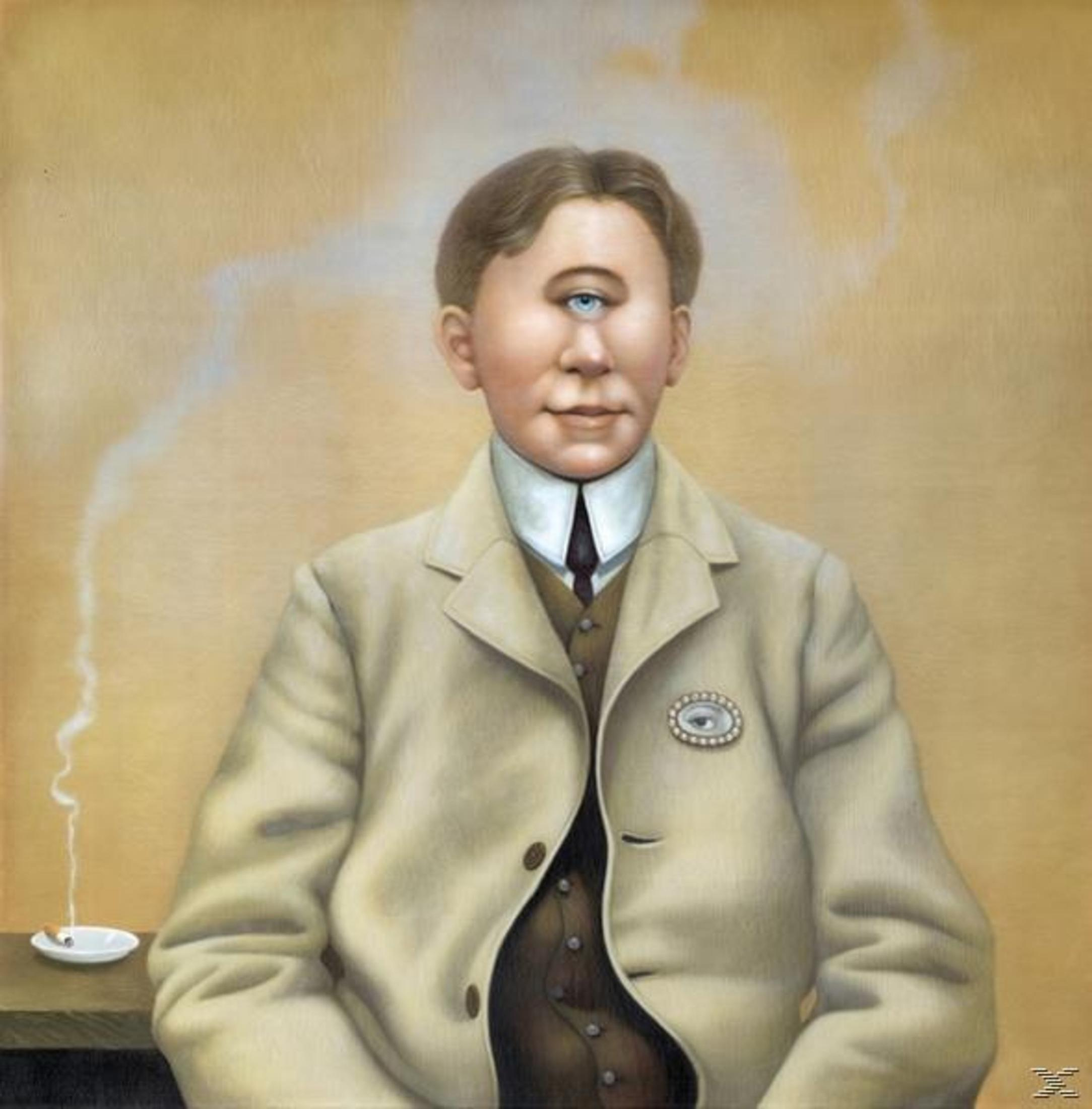 A man with one eye is smoking. He wears a beige suit and a white shirt. A small ashtray with a cigarette is visible.