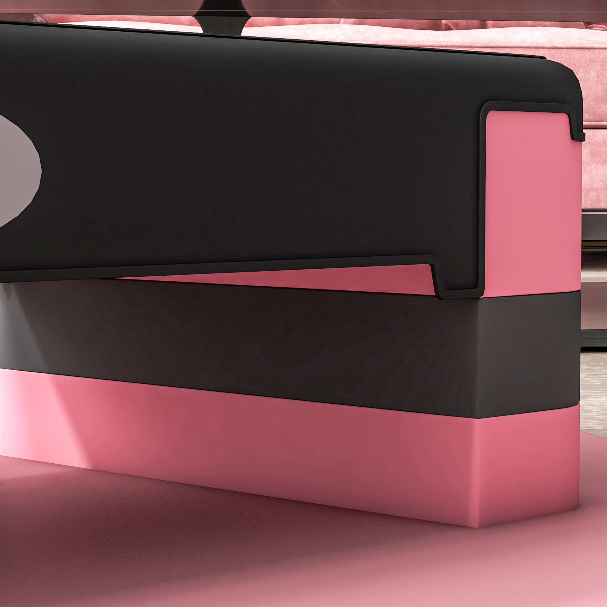 Un oggetto multistrato con pannelli rosa e neri. L'oggetto è su una superficie rosa, con sfondo rosa e un po' di luce.