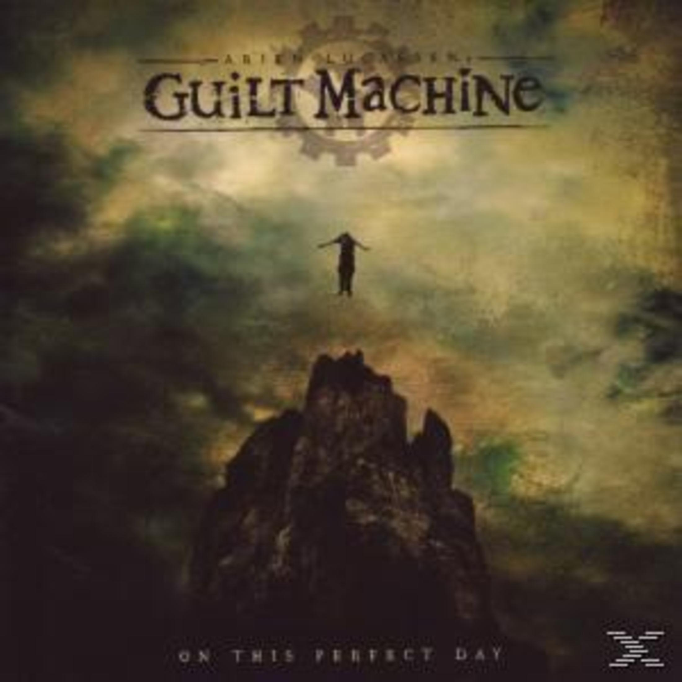 Albumcover: Eine Person mit ausgestreckten Armen über einer dunklen Felsformation, mit dem Text 'Guilt Machine' und 'On This Perfect Day'.