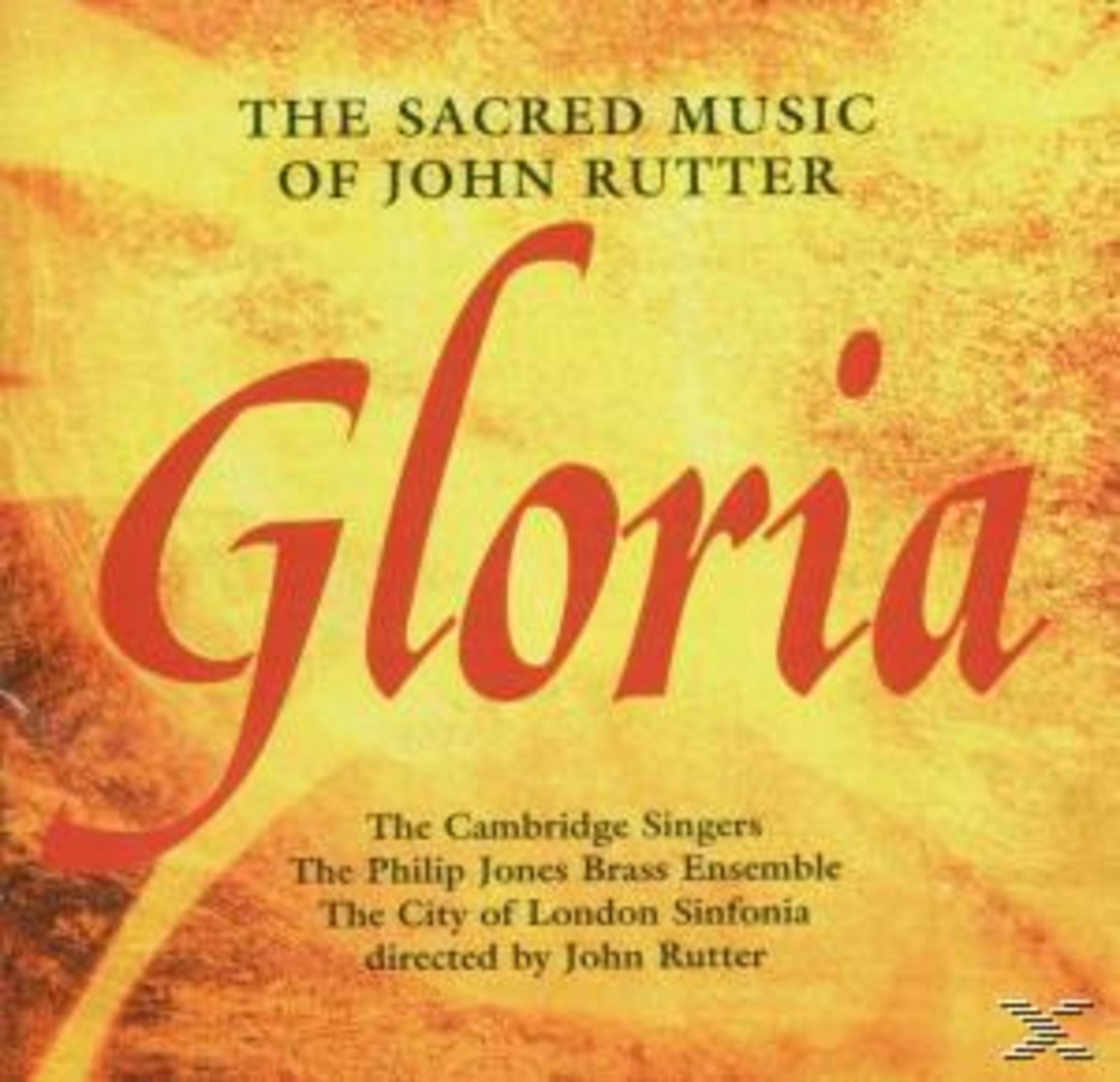 CD-Cover mit "Gloria" in großen roten Buchstaben. Der Text enthält "The Sacred Music of John Rutter" und Credits.