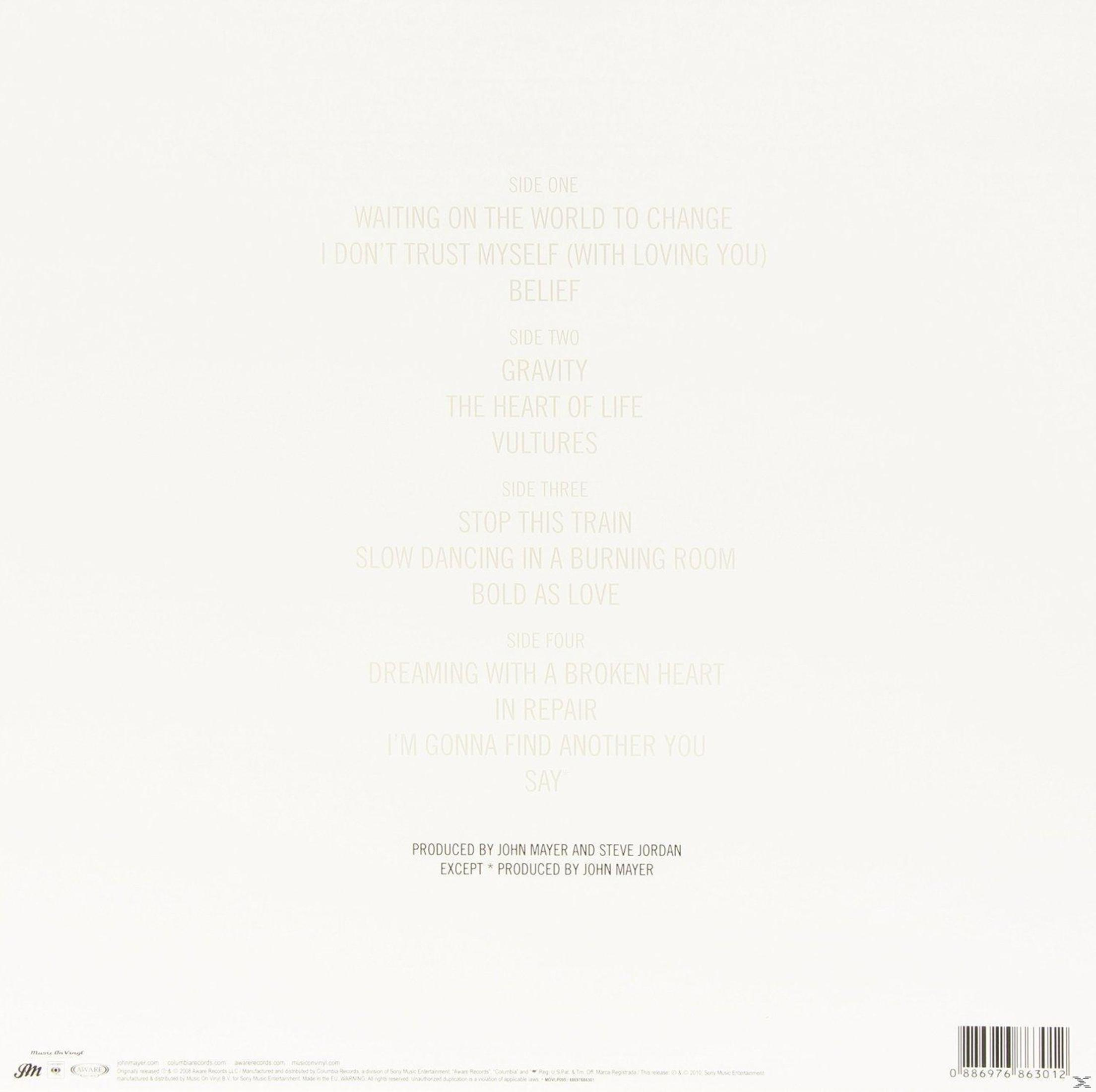 Copertina dell'album con titoli come "Waiting on the World to Change". Il layout è bianco con testo dorato. Prodotto da John Mayer.