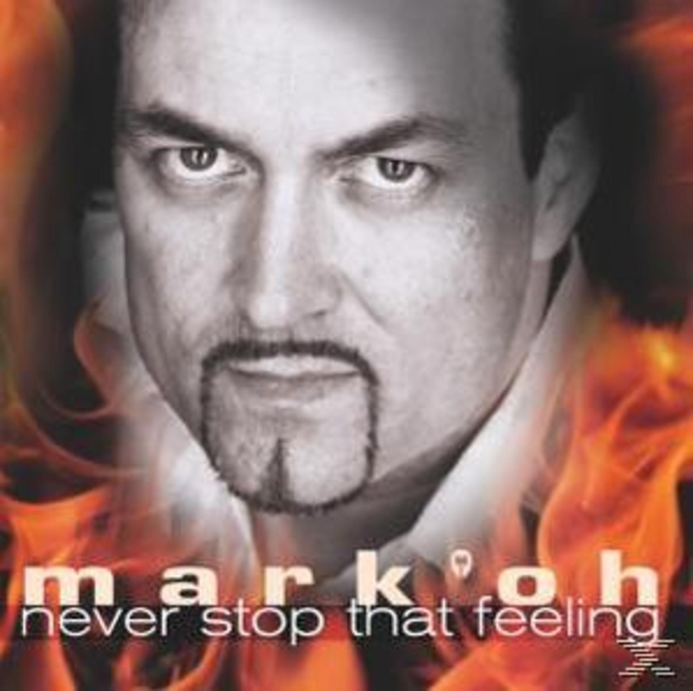 Albumcover mit dem Gesicht eines Mannes, Flammen und dem Text 'markoh never stop that feeling'.
