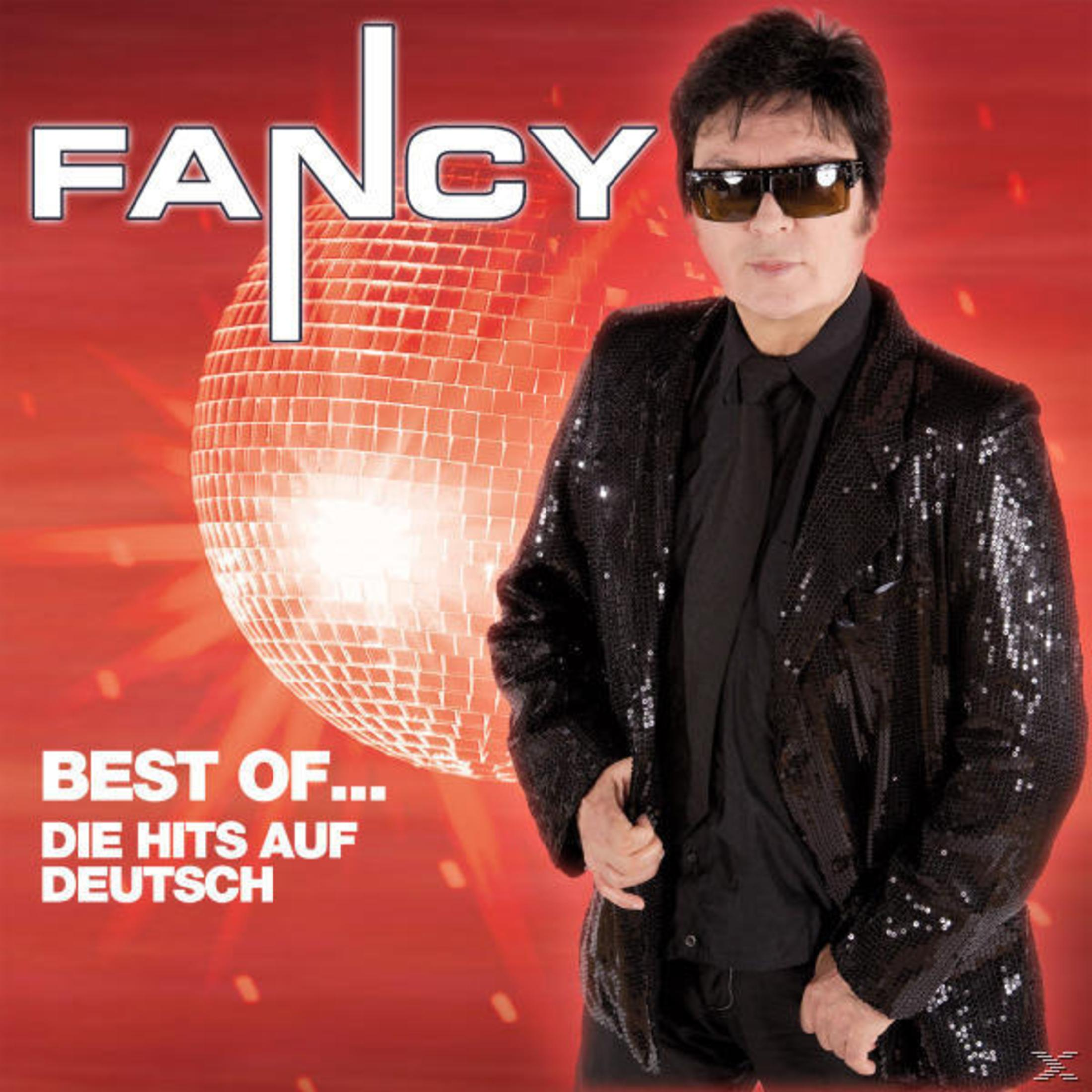 Albumcover mit Mann in Sonnenbrille und schwarzer Paillettenjacke. Eine Discokugel im Hintergrund. Der Titel 'Fancy' ist sichtbar.