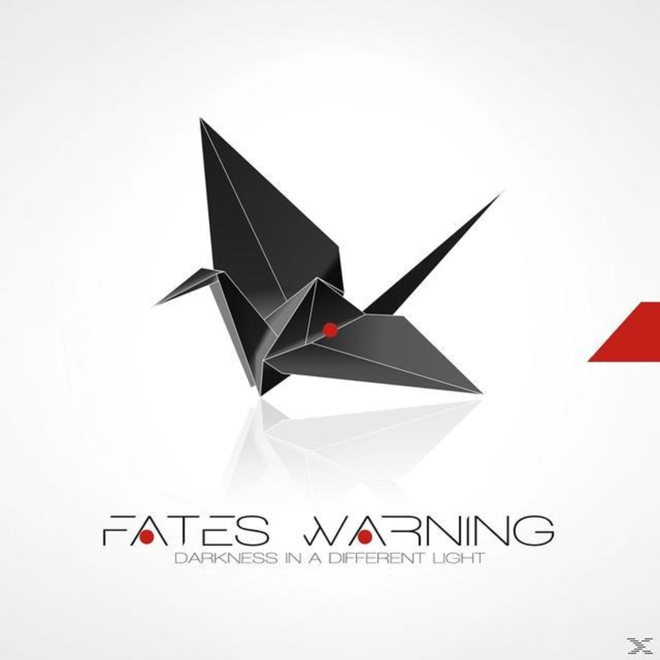 Schwarzer Origami-Kranich mit roten Punkten. Weißer Hintergrund mit Text: Fates Warning, Darkness in a Different Light.