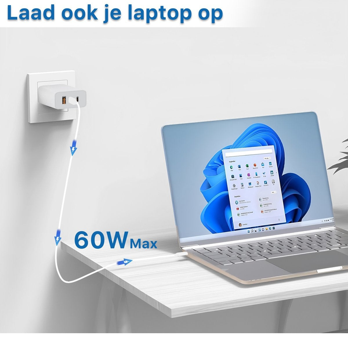 Laptop opladen met witte oplader in stopcontact. Laptop toont Windows 11 startmenu. Oplader: 60W Max.