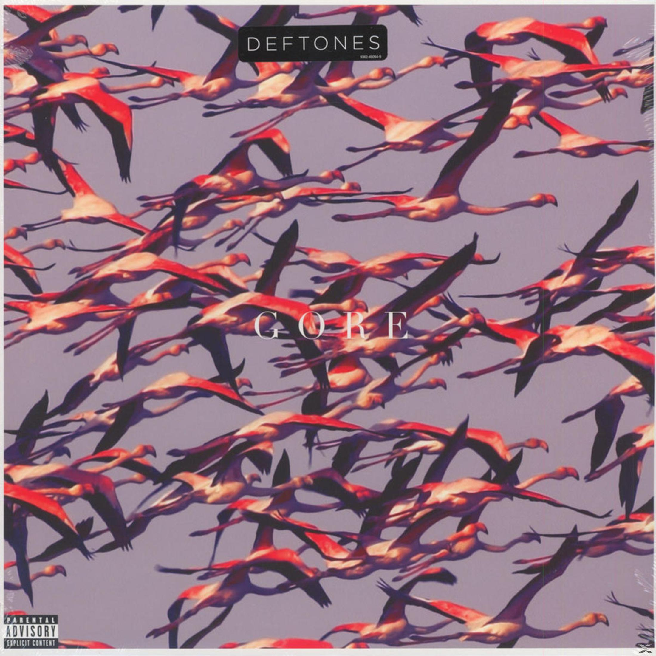 Copertina dell'album: Fenicotteri in volo, rossi e rosa contro un cielo viola. La parola 'GORE' è bianca. Logo Deftones.