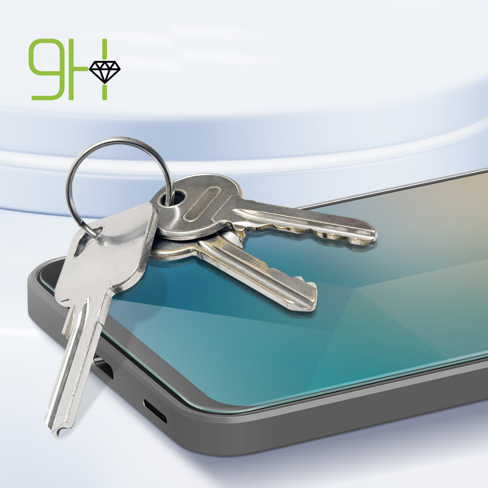 Chiavi su un telefono. Il telefono ha una protezione per lo schermo. Logo verde e diamante sullo sfondo.