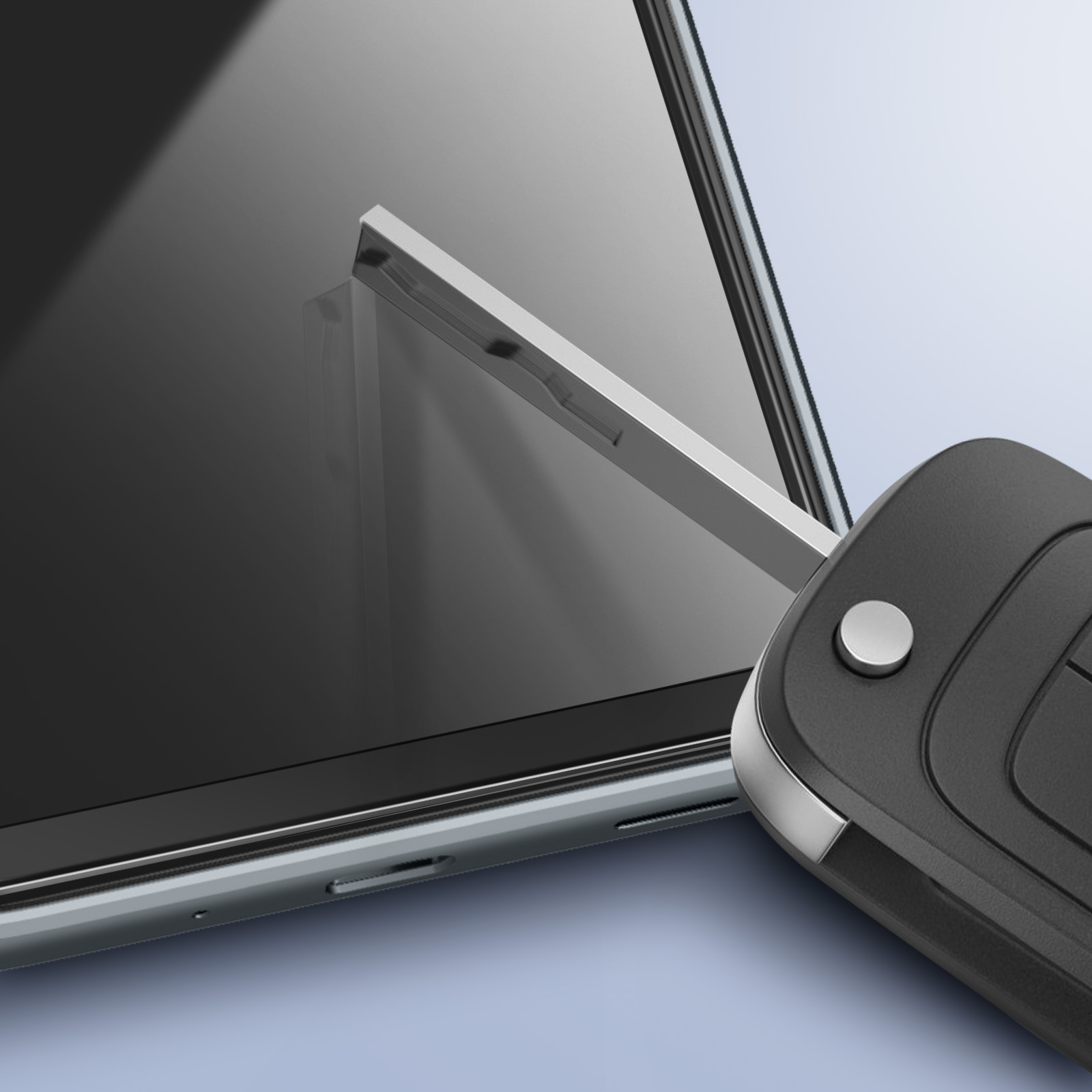 Una chiave dell'auto è appoggiata su un tablet. La chiave è nera e il tablet argentato con schermo nero. Lo sfondo è azzurro.